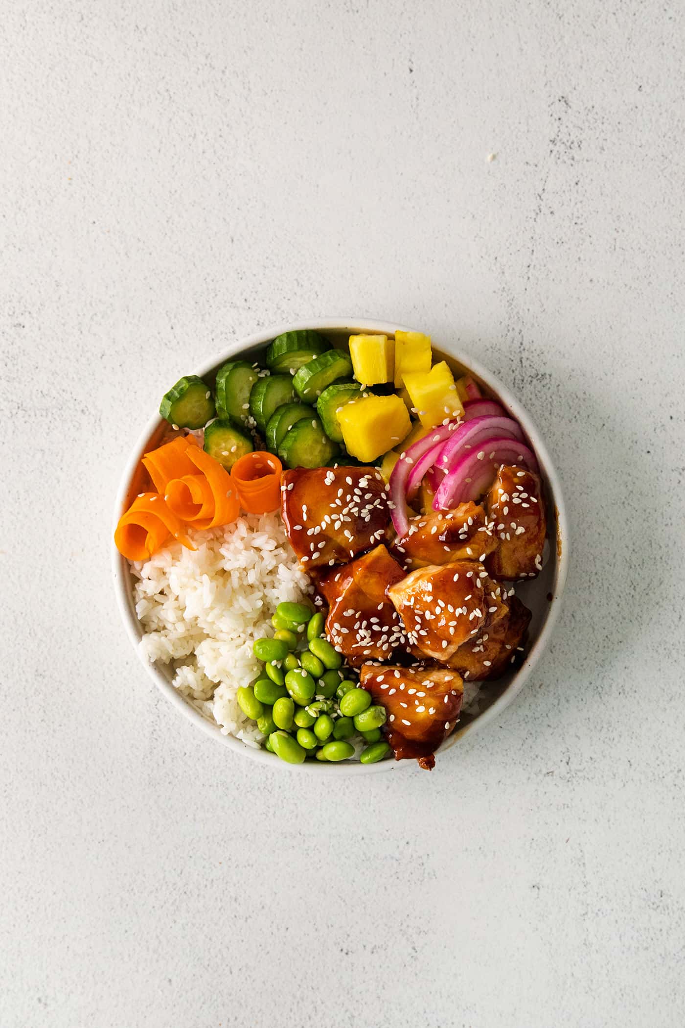 Overhead view of a teriyaki chicken rice bowl