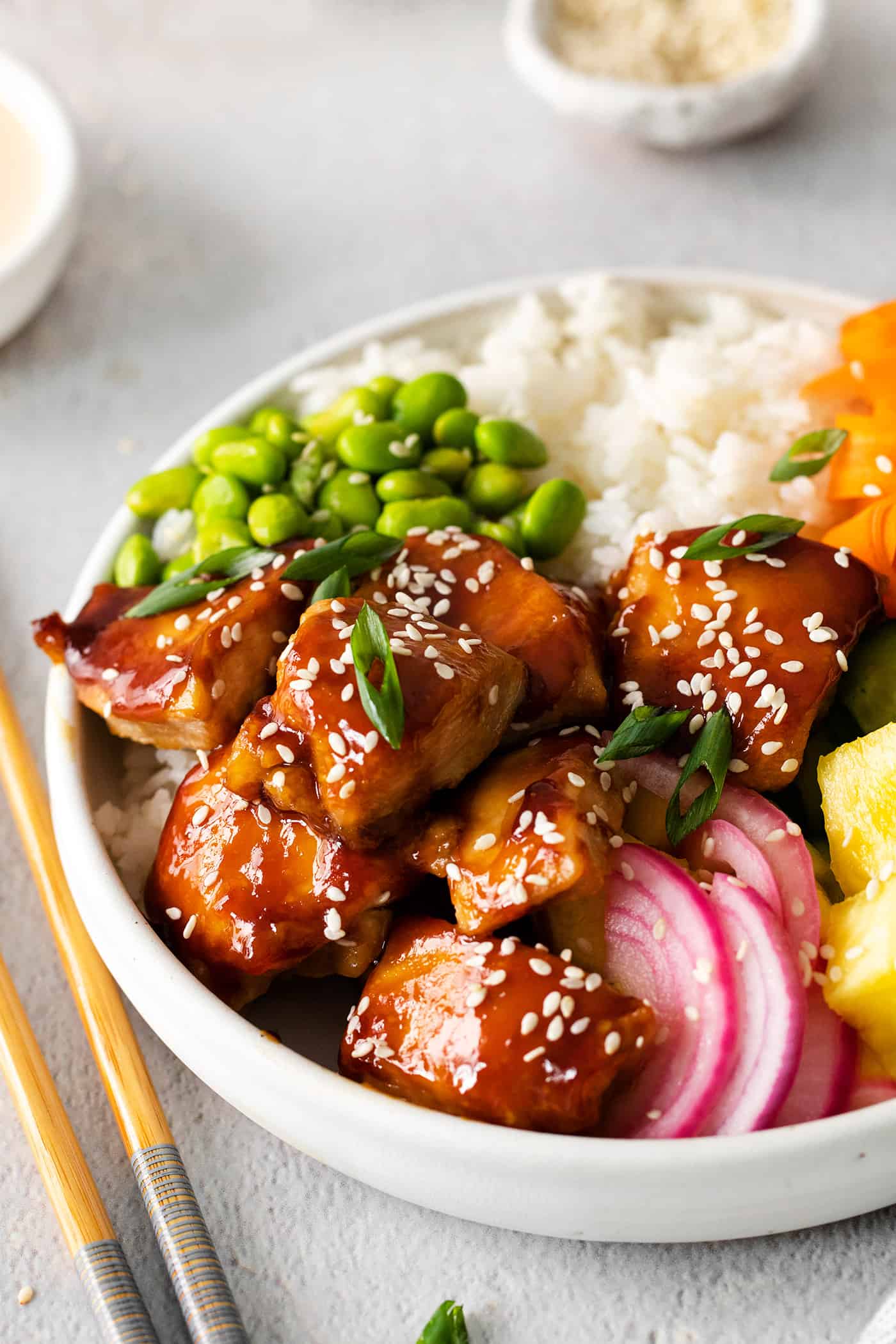 Angled overhead view of a teriyaki chicken rice bowl