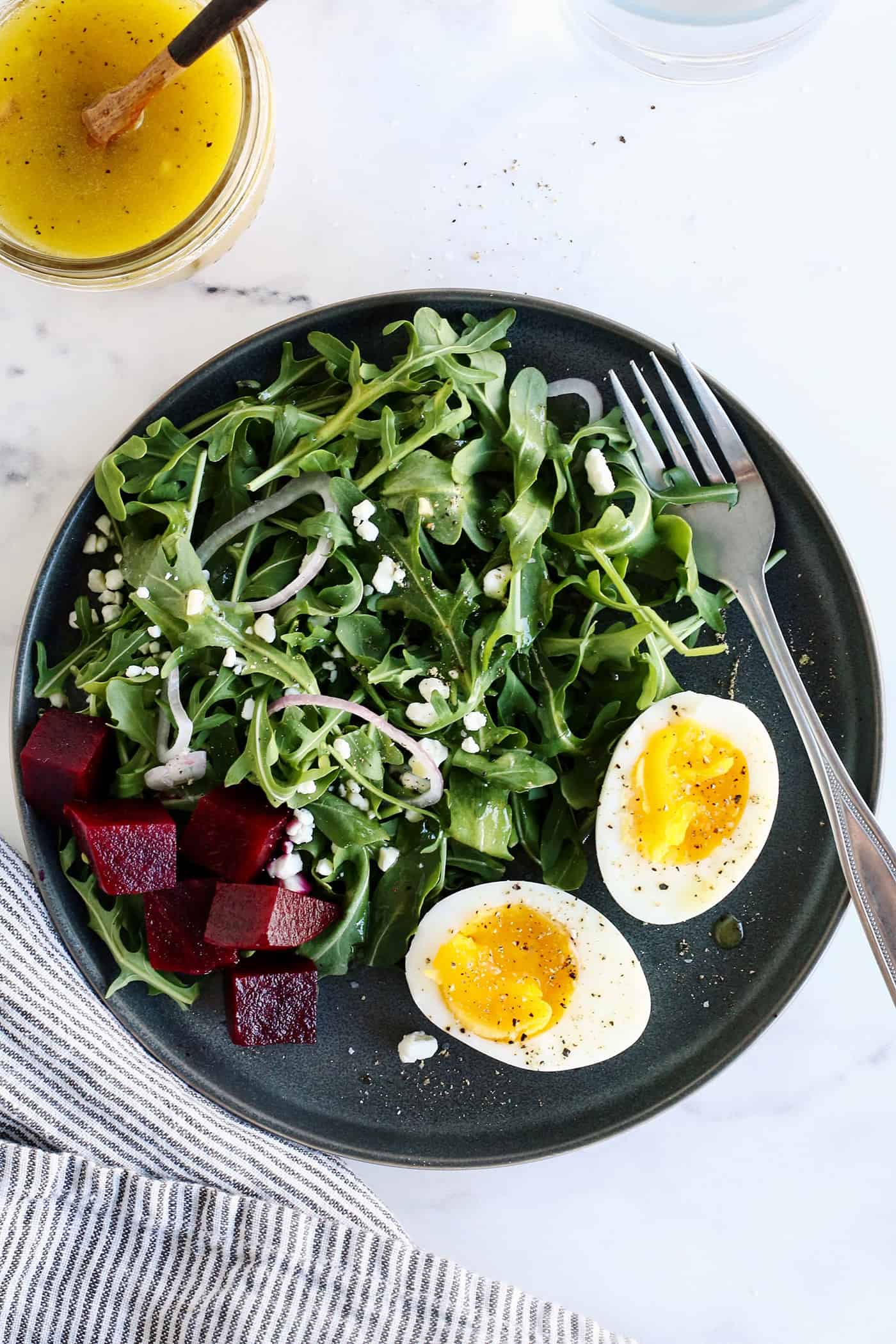 A plate of air fryer hard boiled eggs pickled beets and salad