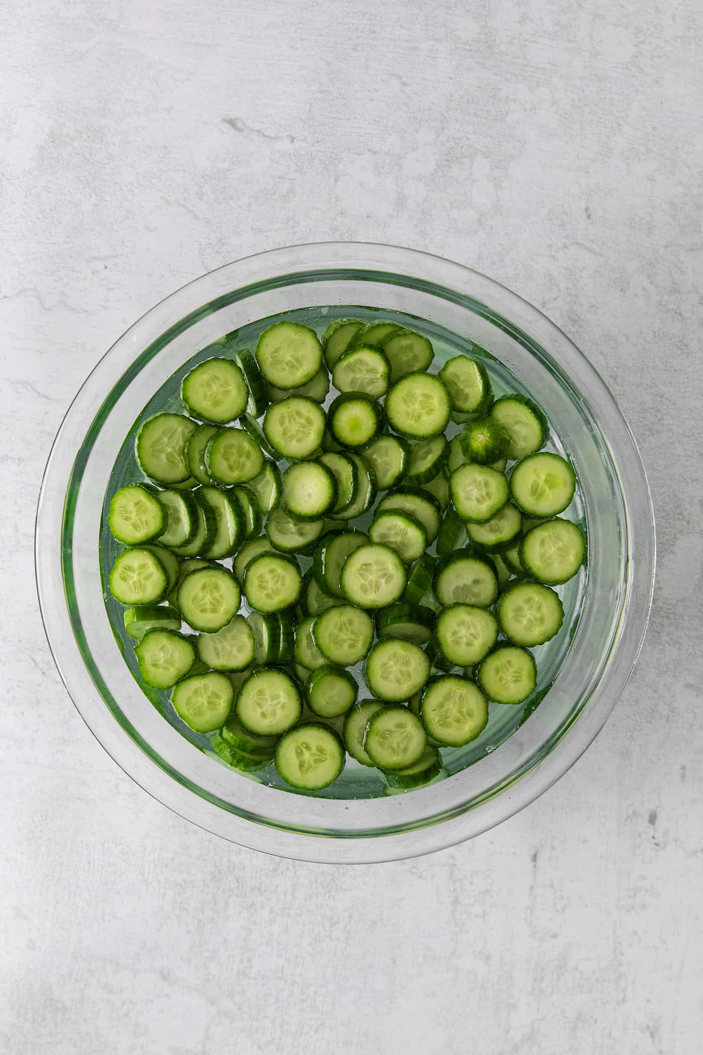 Slices of cucumber soaking in water