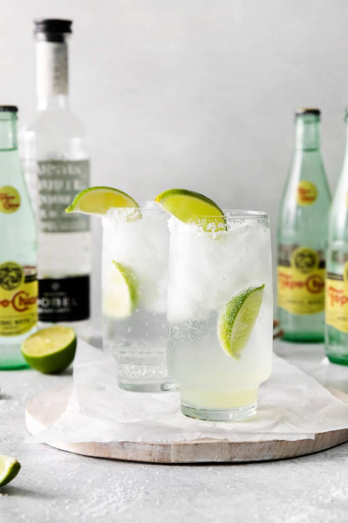 glasses of Texas ranch water cocktail with bottles of Topo Chico