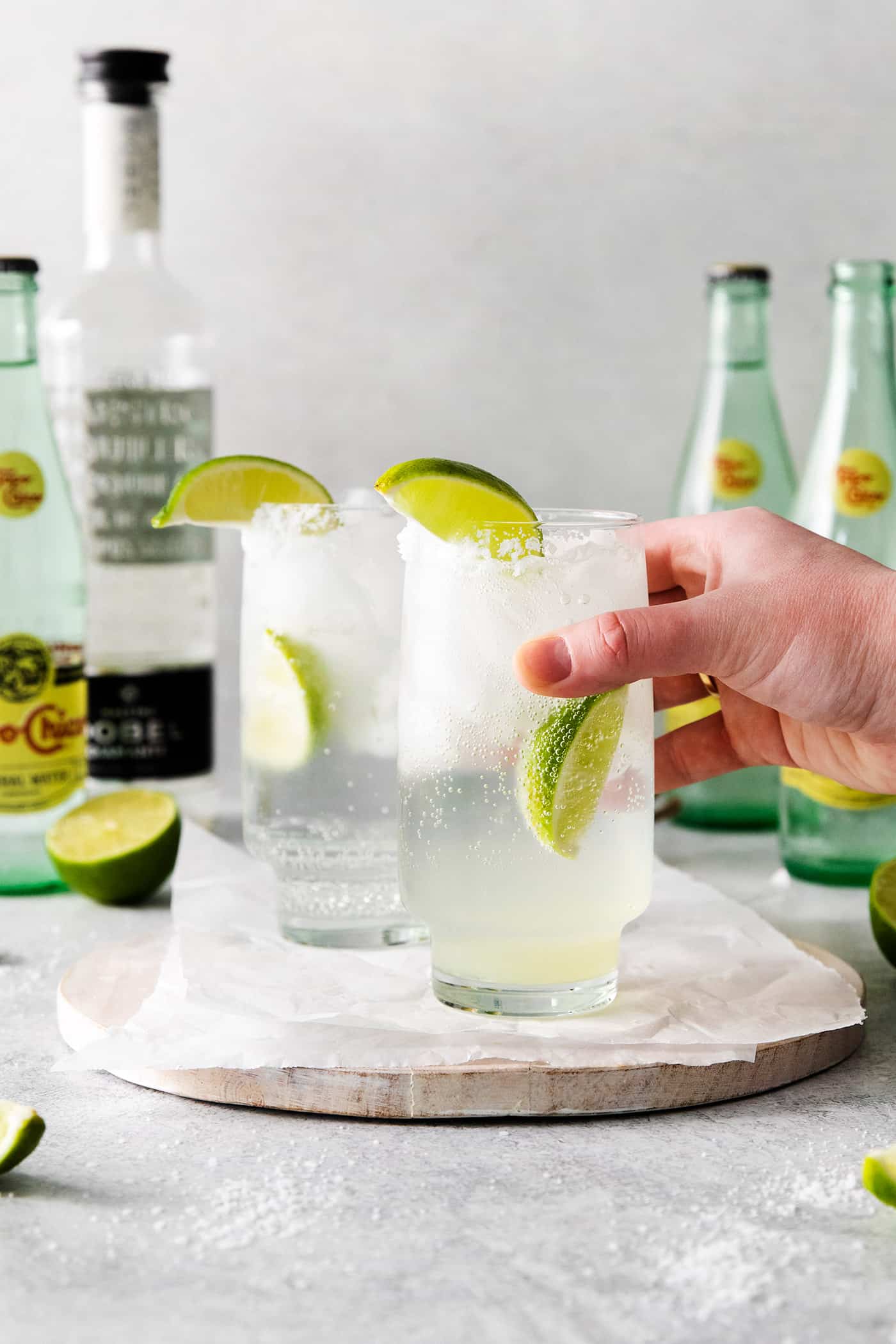 holding a glass of ranch water cocktail