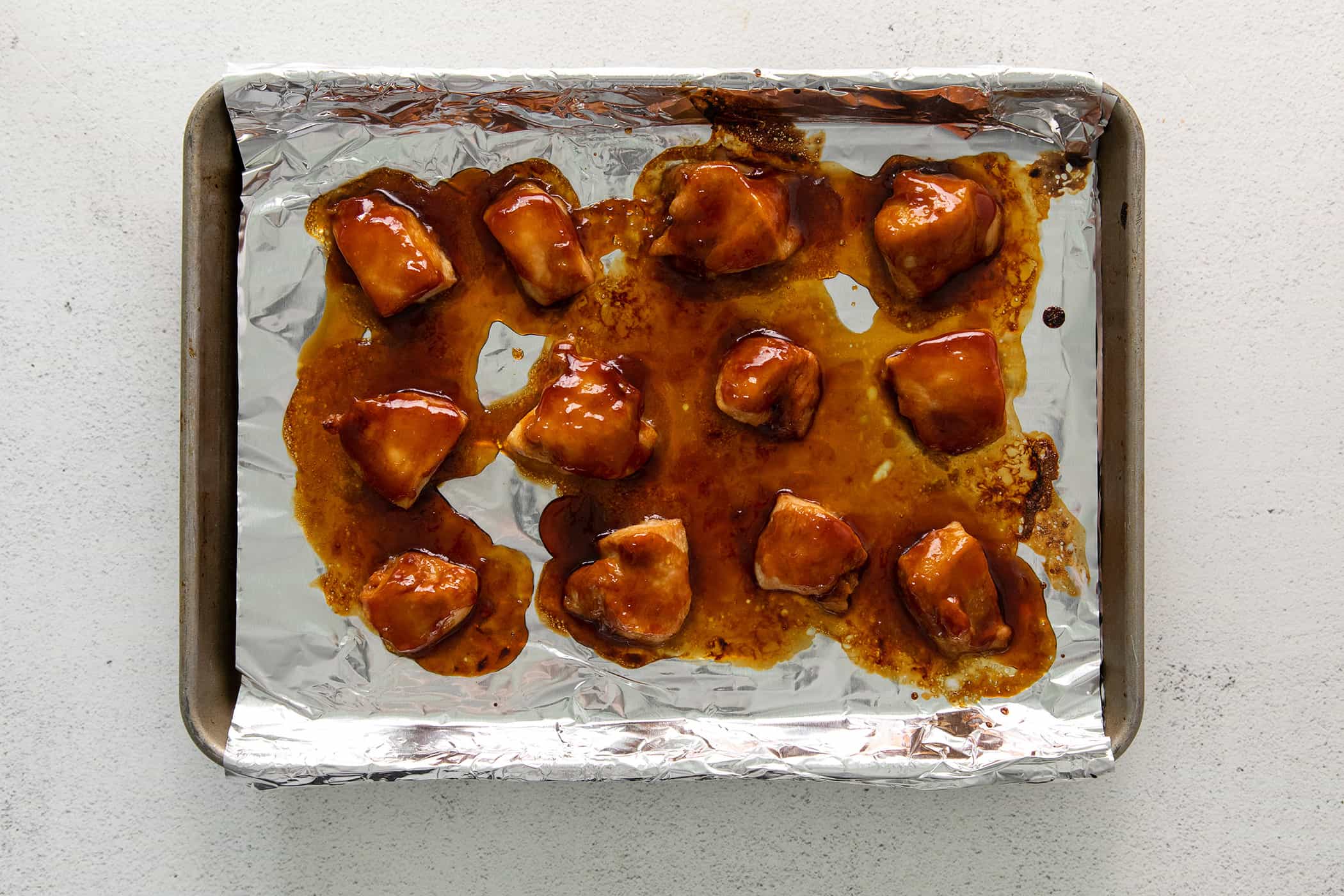 teriyaki chicken baked on a pan