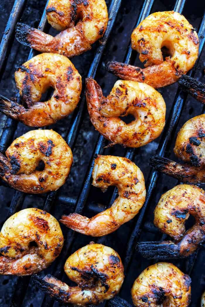 Overhead view of jumbo shrimp on a grill.