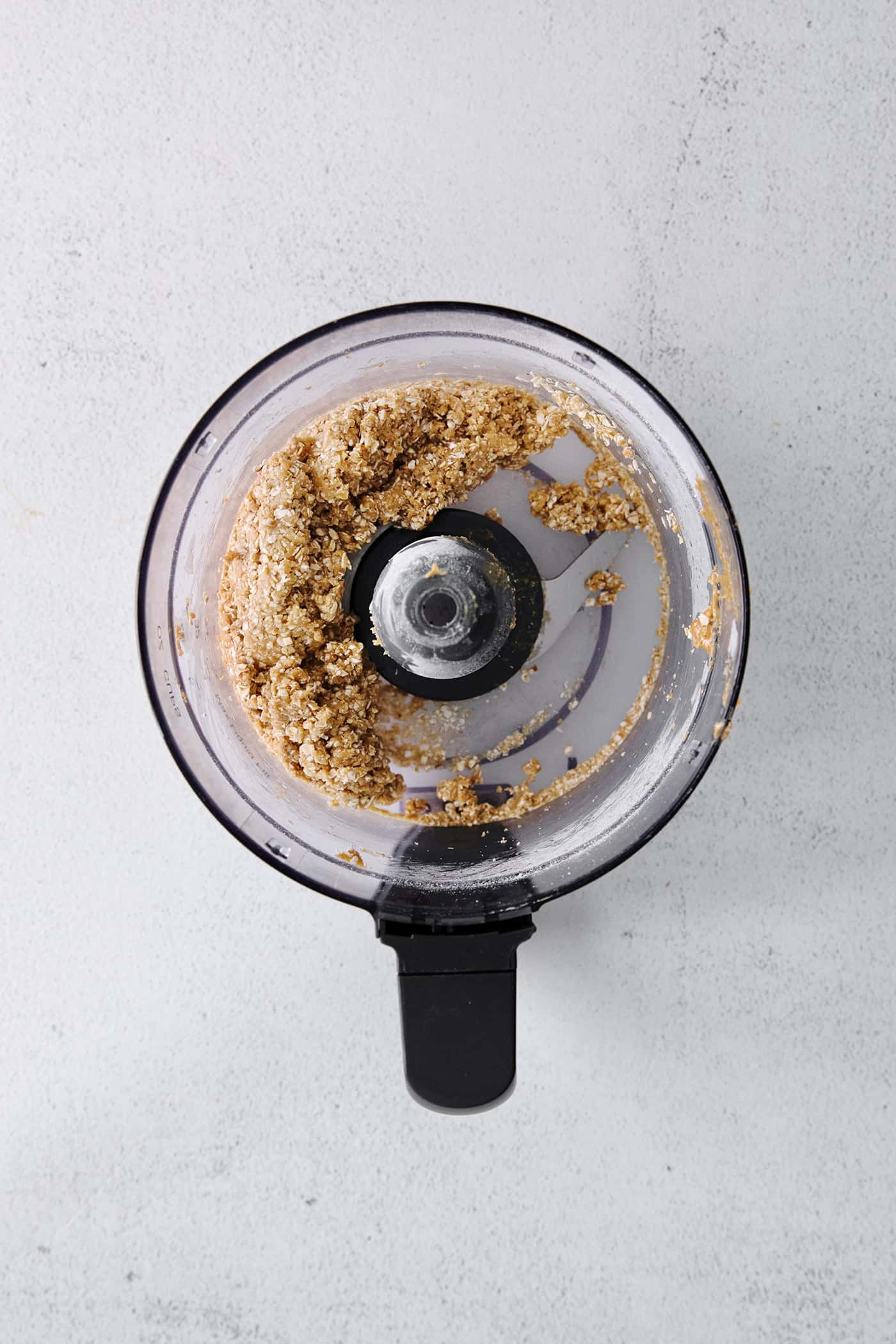 Peanut butter oat bite dough in a food processor