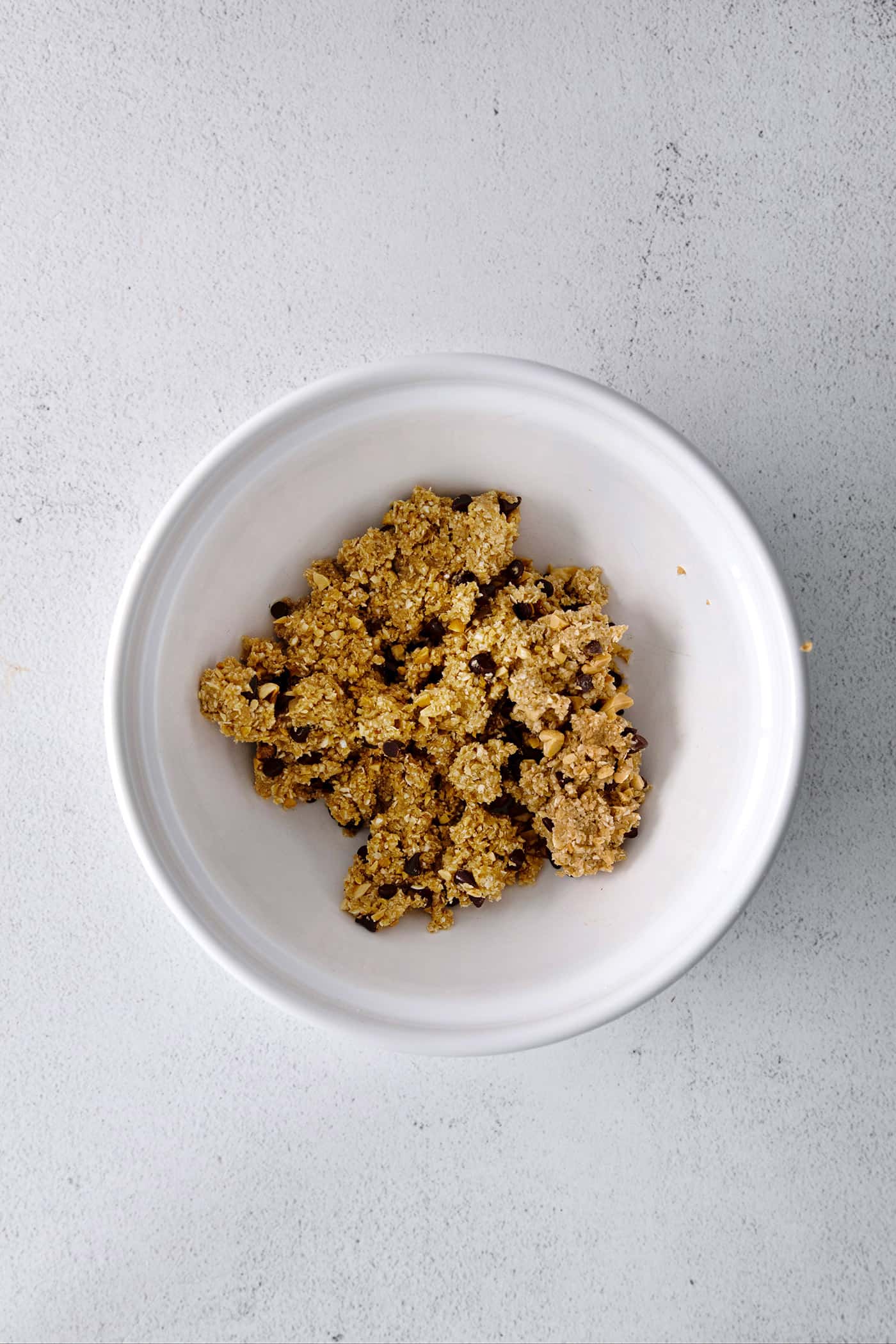 peanut butter oat bites dough in a white bowl