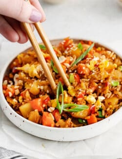 Chopsticks in pineapple fried rice