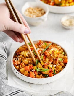 Chopsticks in pineapple fried rice