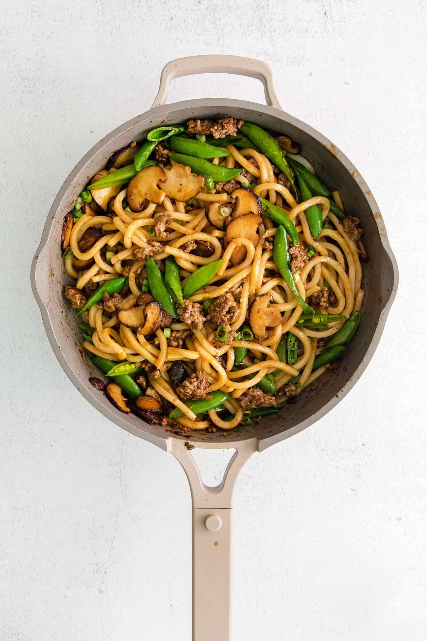 Beef yaki udon stir fried noodles in a skilllet