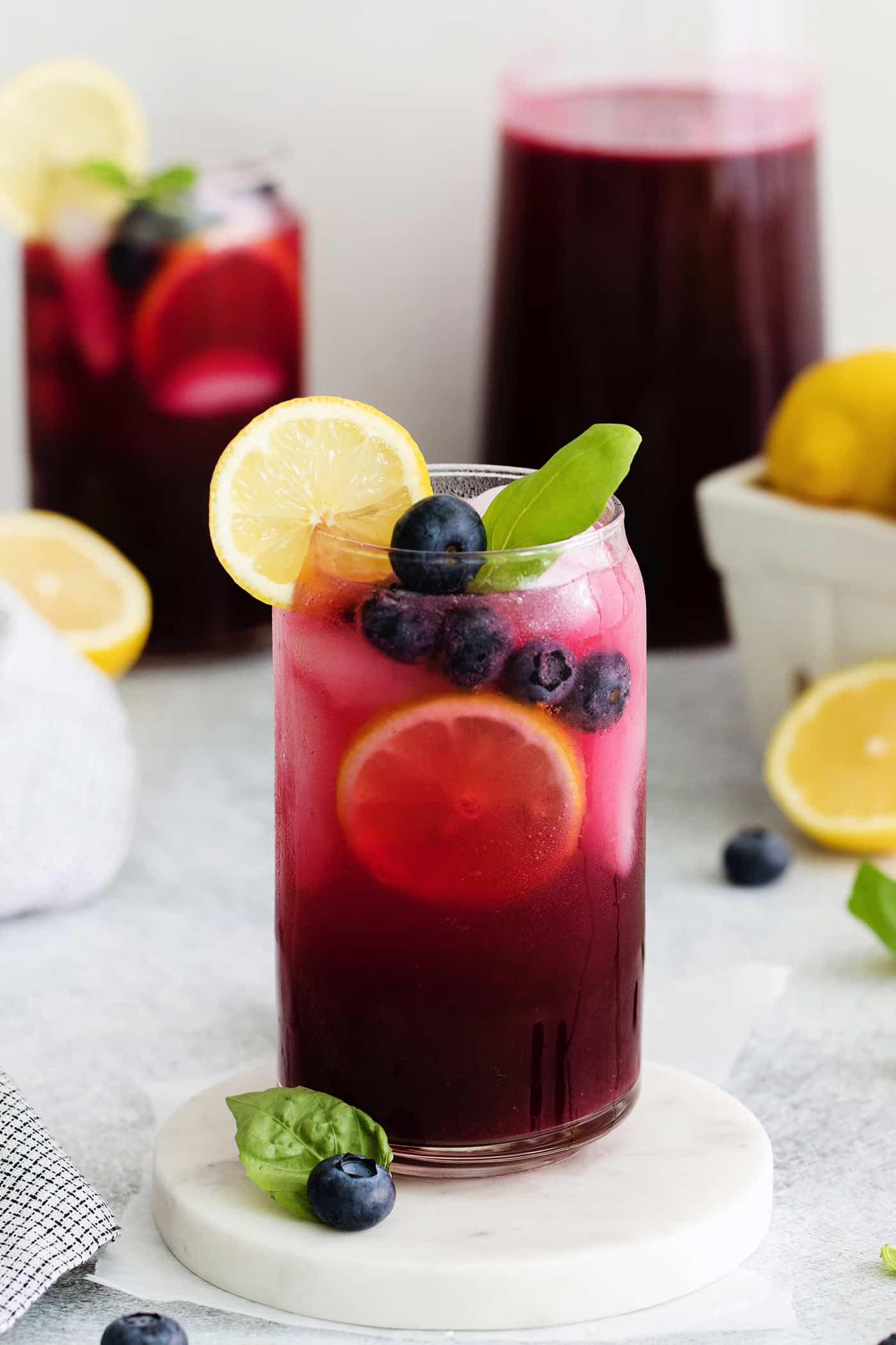 A glass of blueberry basil lemonade