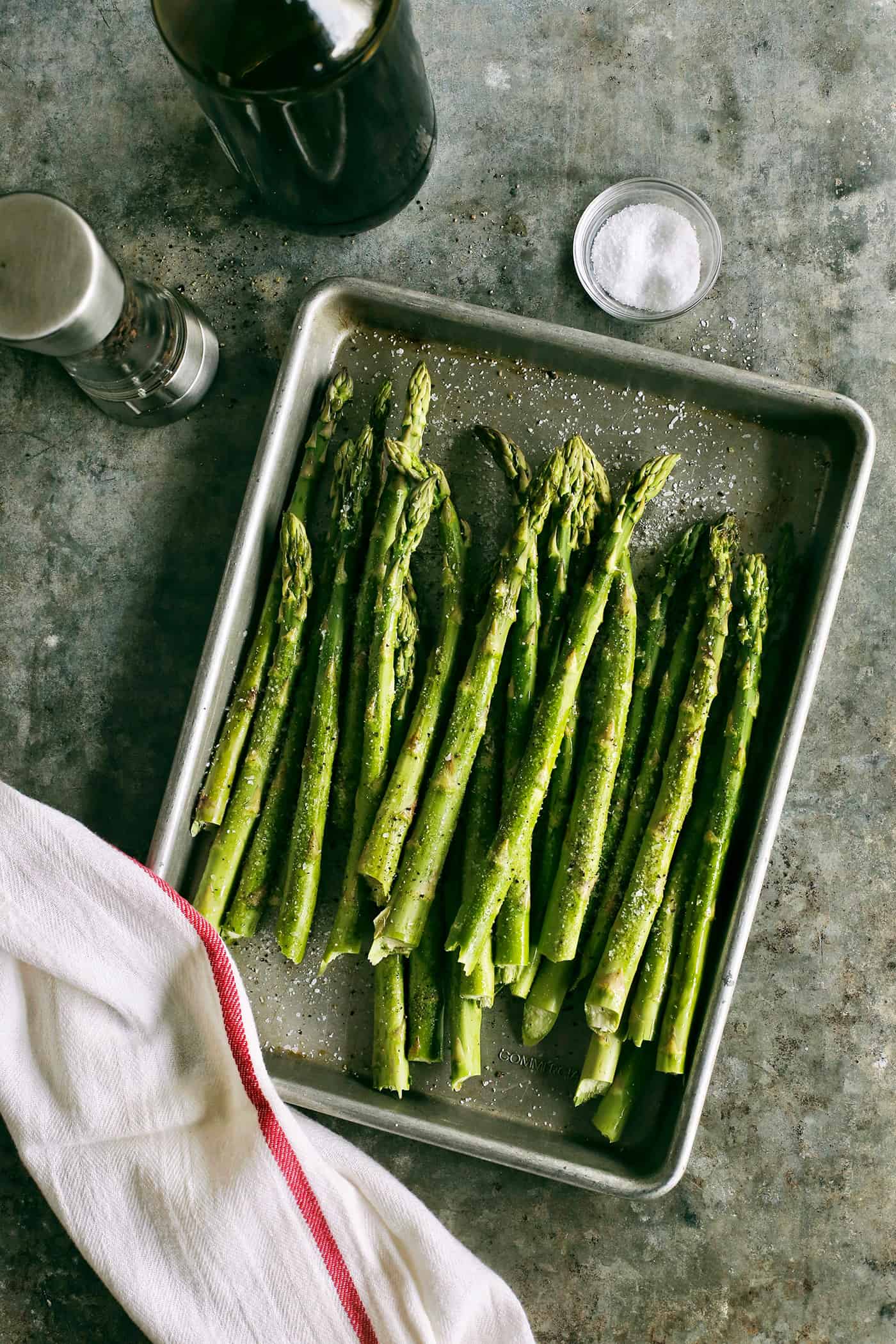 Trimmed asparagus in a baking sheet