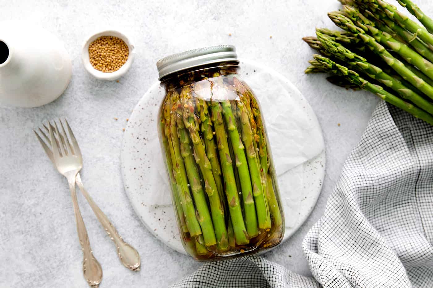 Overhead view of a jar of pickled asparagus