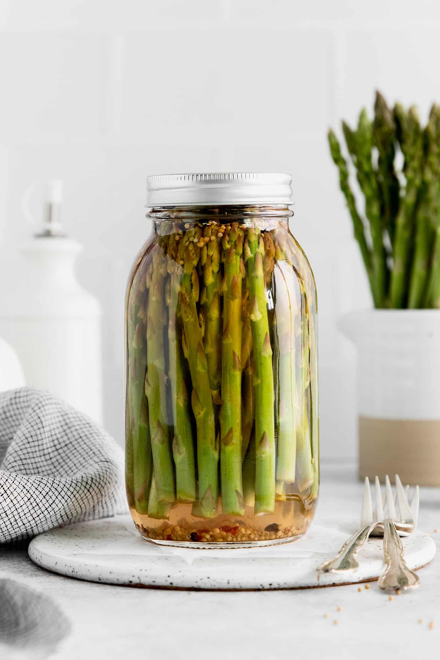 With a simple pickling brine and a few spices, these Quick Pickled Asparagus has a tangy, robust flavor with just a bit of heat. A jar of pickled asparagus
