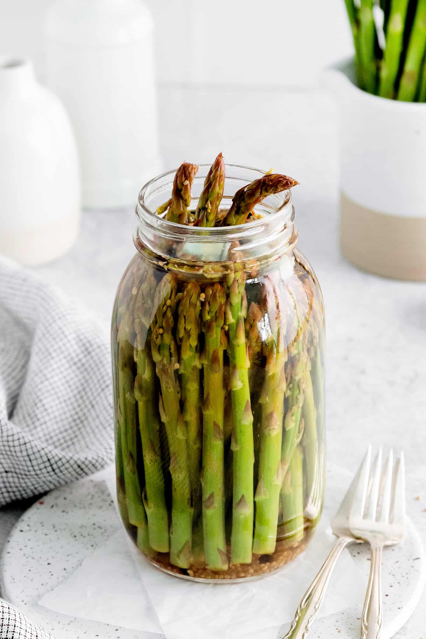 An open jar of asparagus