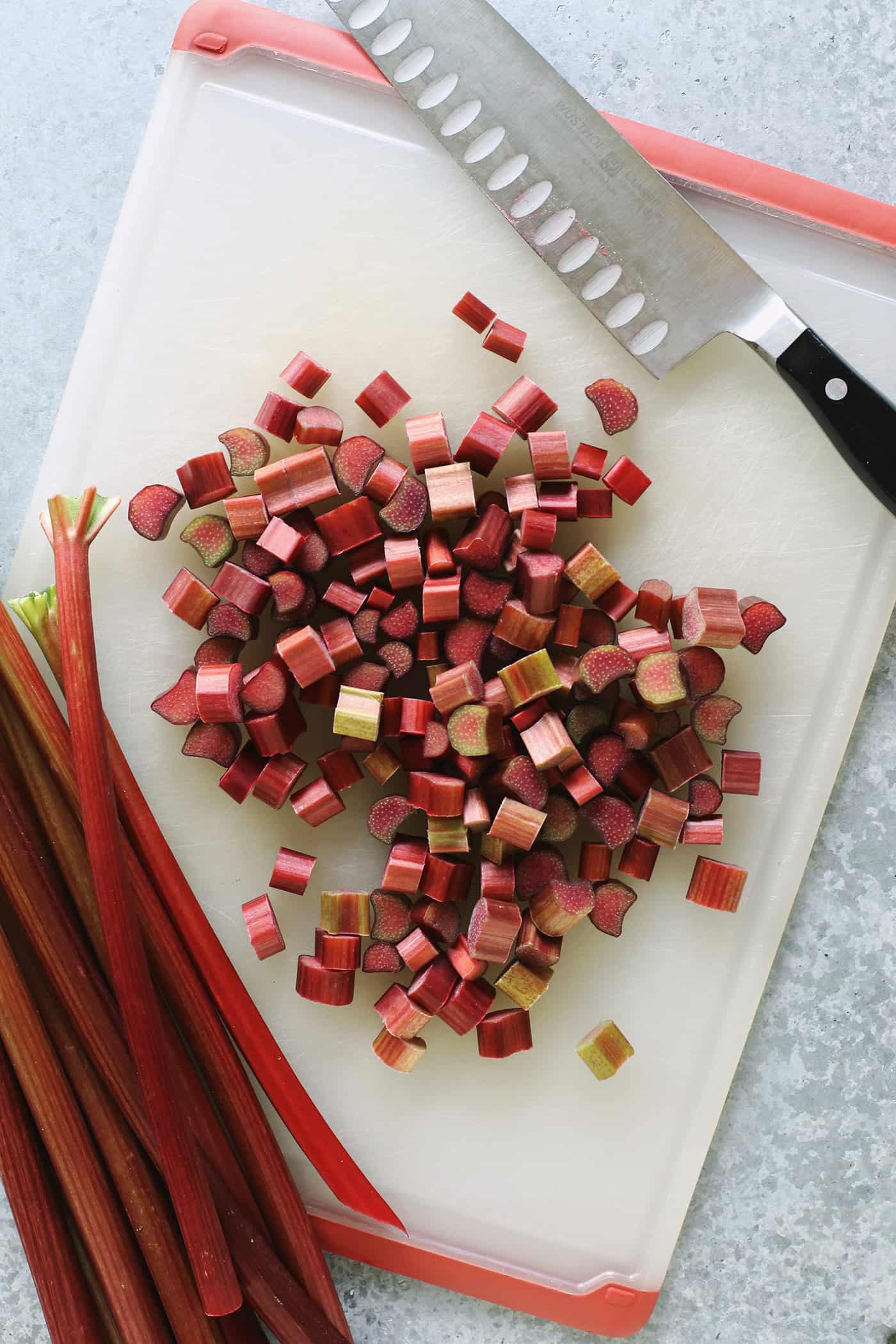 Rhubarb cut into small pieces on a cutting board