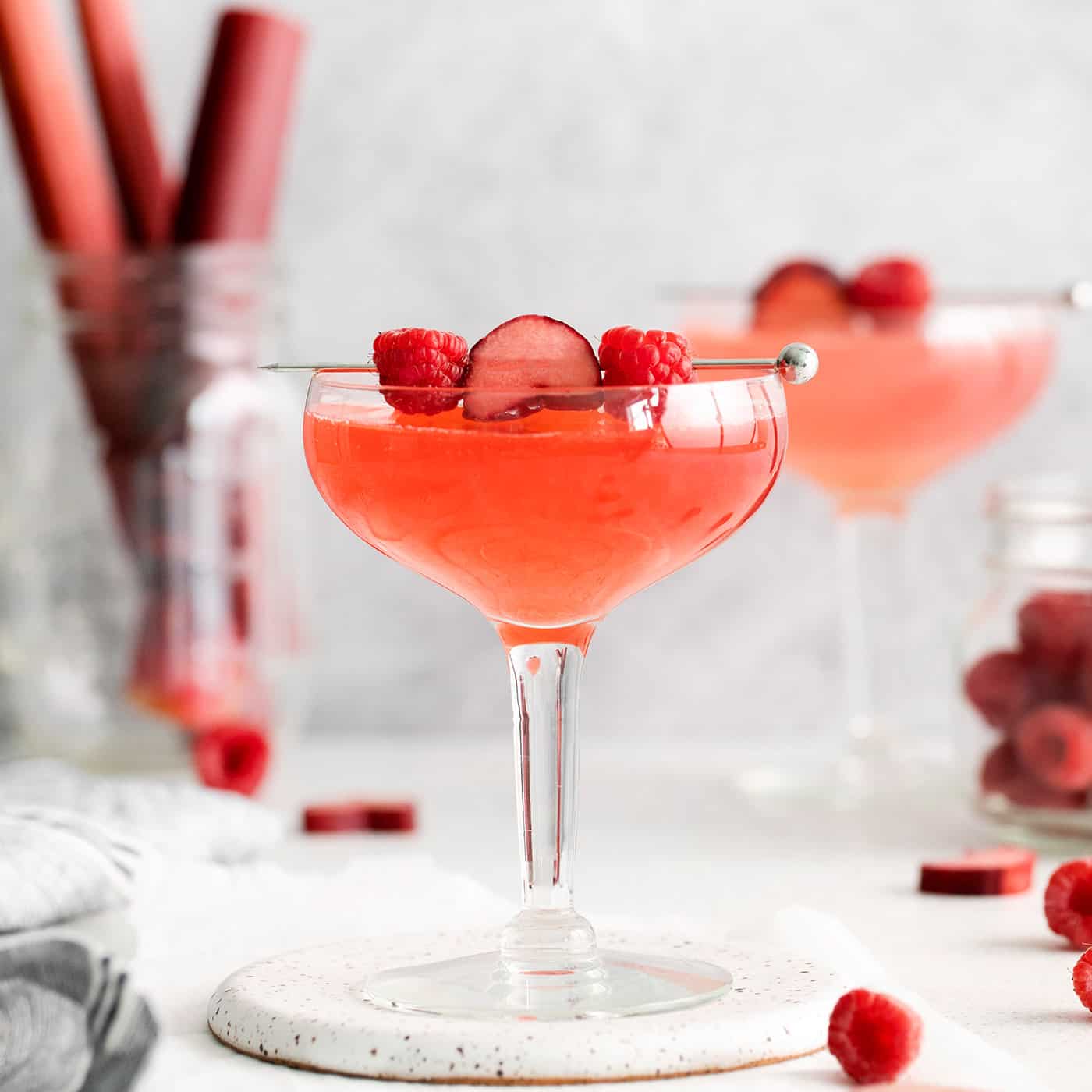 Two raspberry rhubarb cosmopolitans