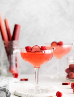 Two raspberry rhubarb cosmopolitans