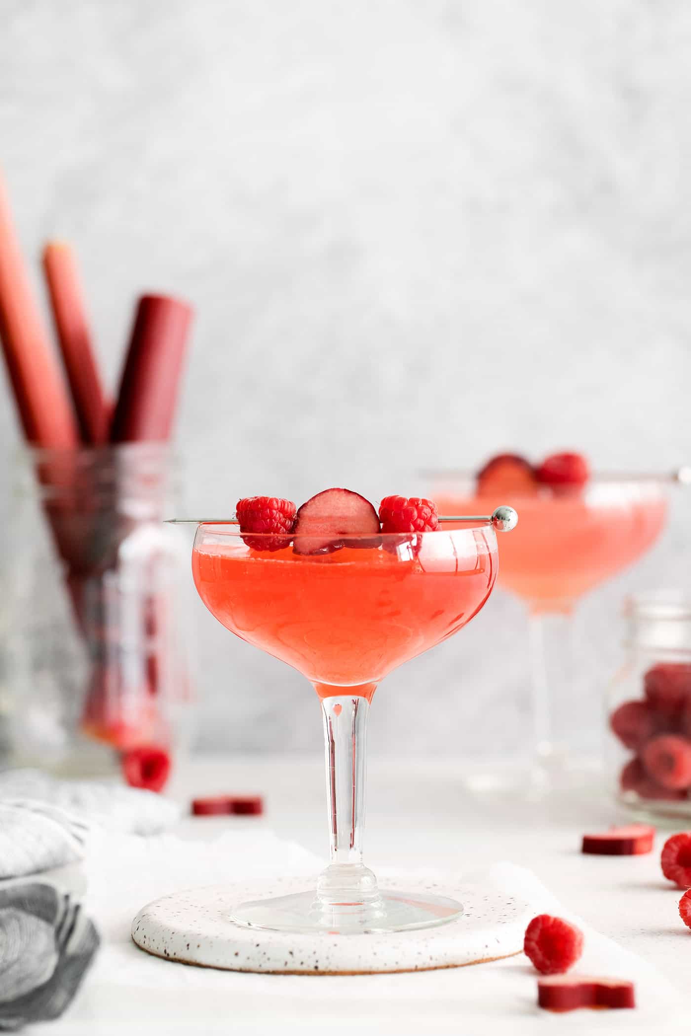 Two raspberry rhubarb cosmopolitans