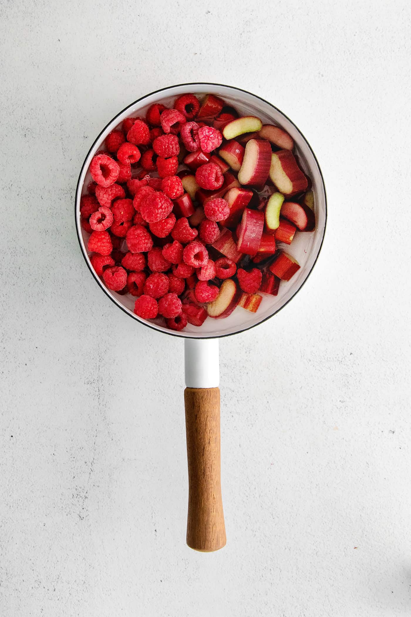 Raspberries and rhubarbs in a saucepan