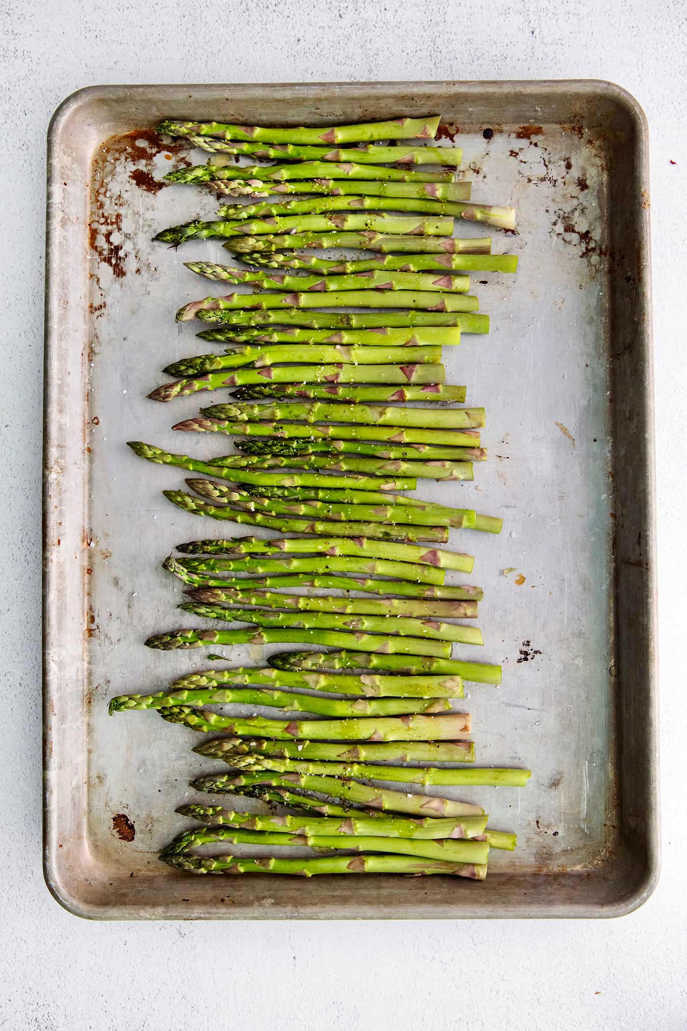 asparagus on a rimmed pan