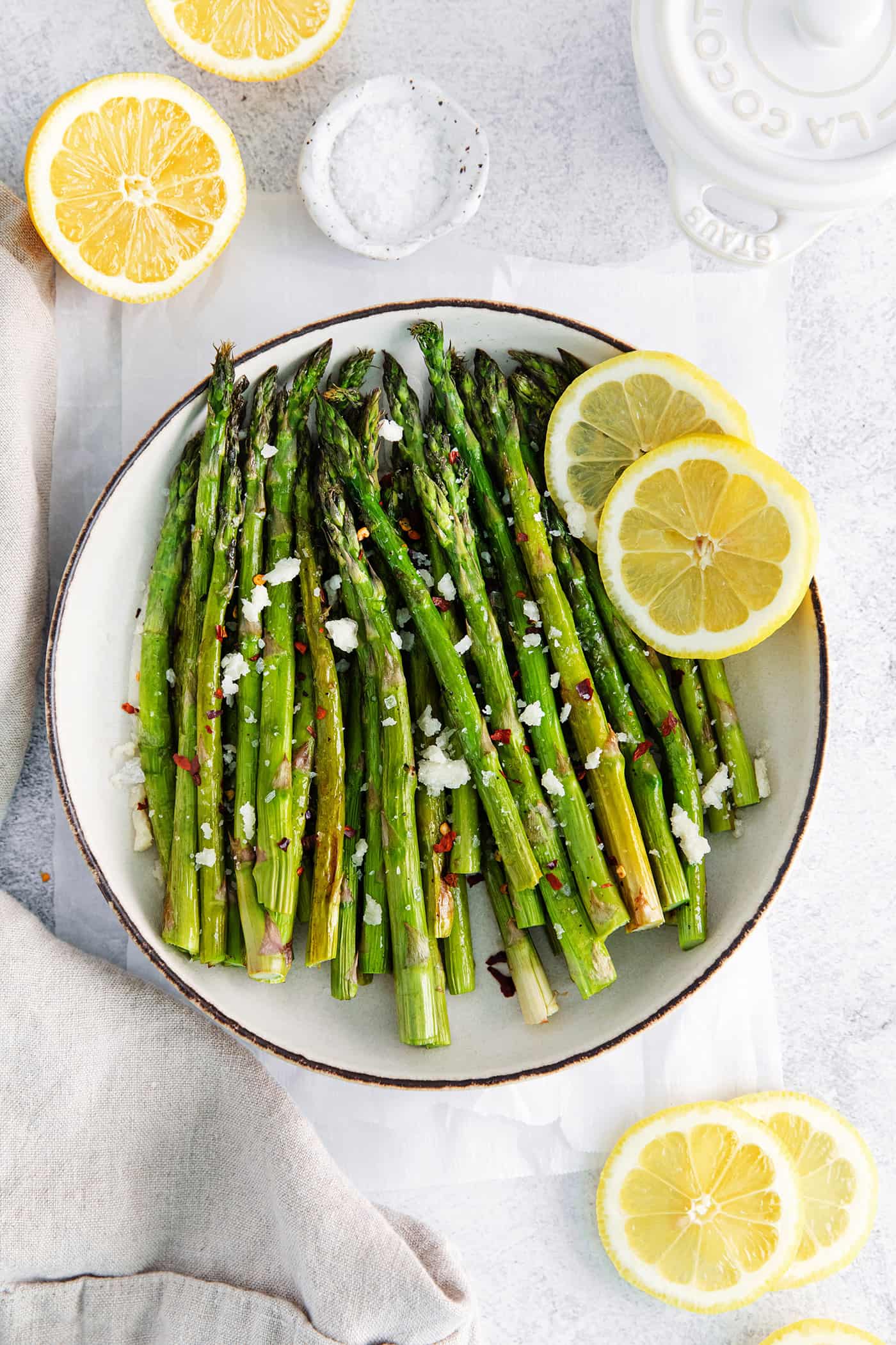 Overhead view of a bowl of roasted asparagus