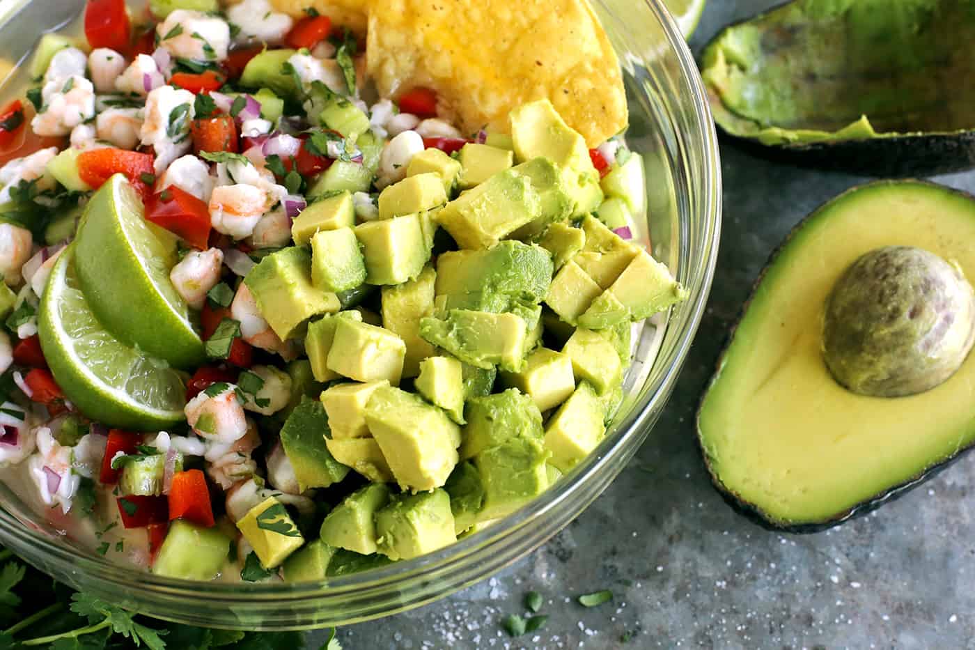 Avocado added to a bowl of ceviche