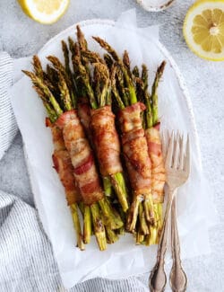Overhead view of bacon wrapped asparagus on a plate
