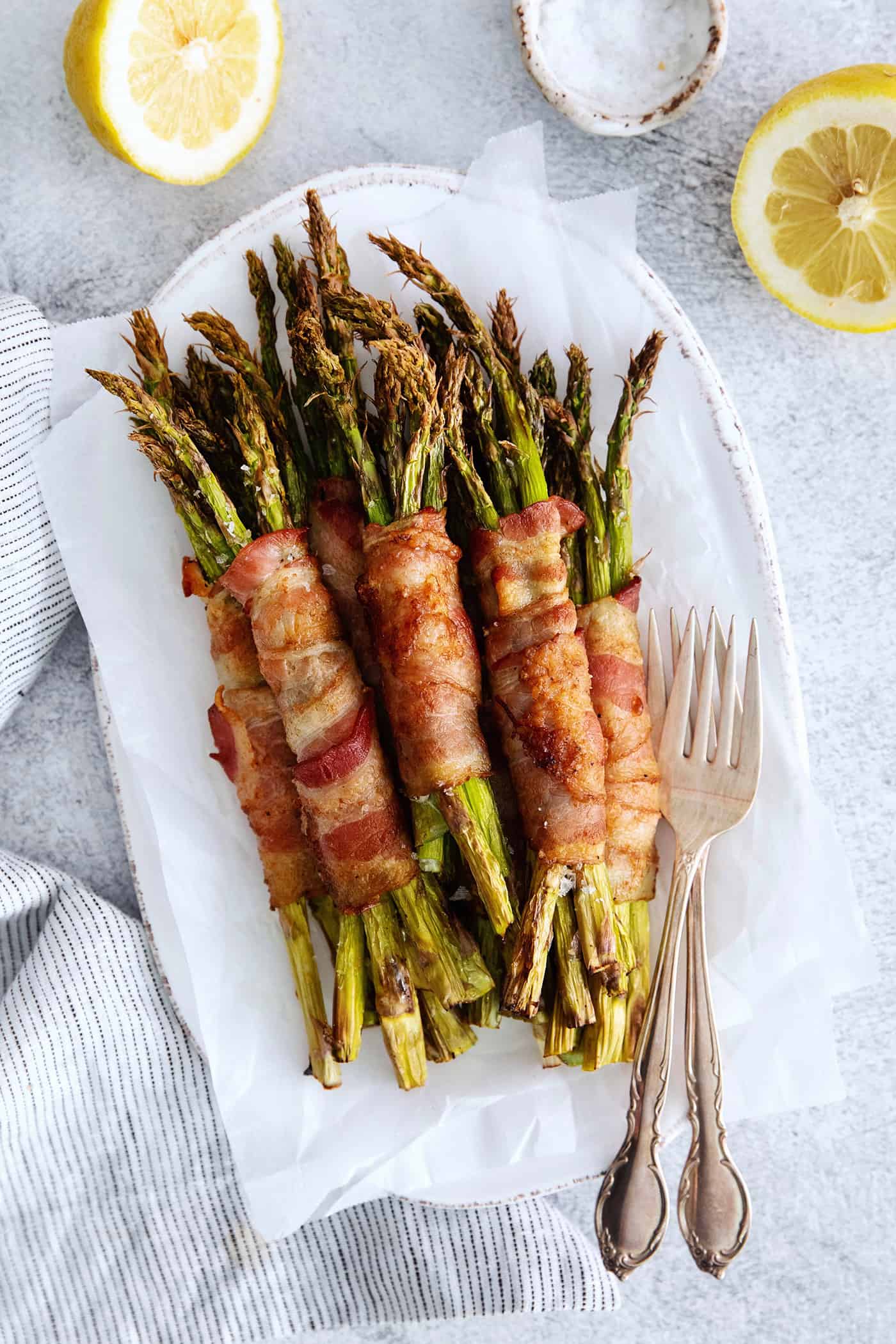 Overhead view of bacon wrapped asparagus on a plate