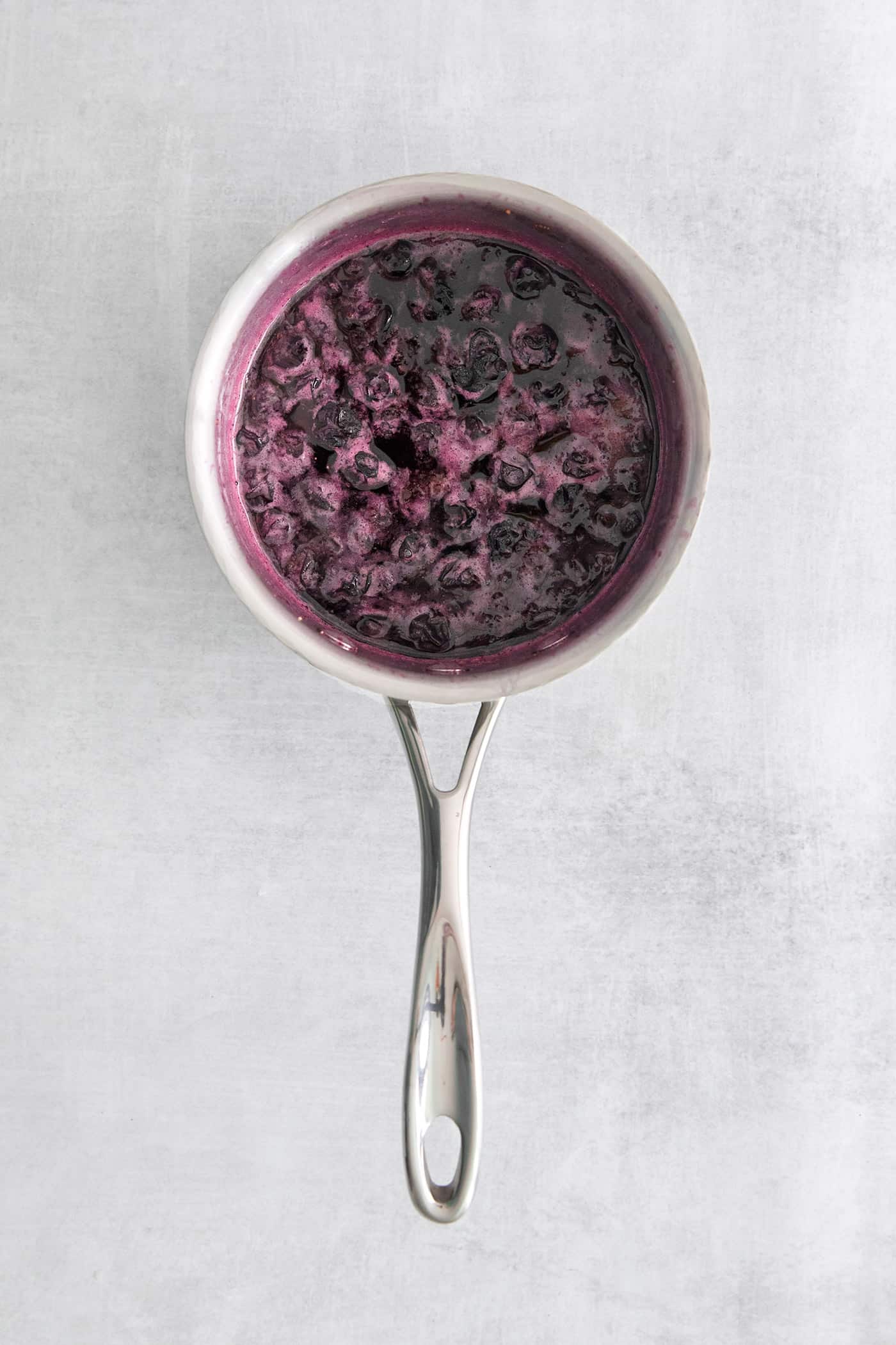 Blueberry simple syrup in a pan