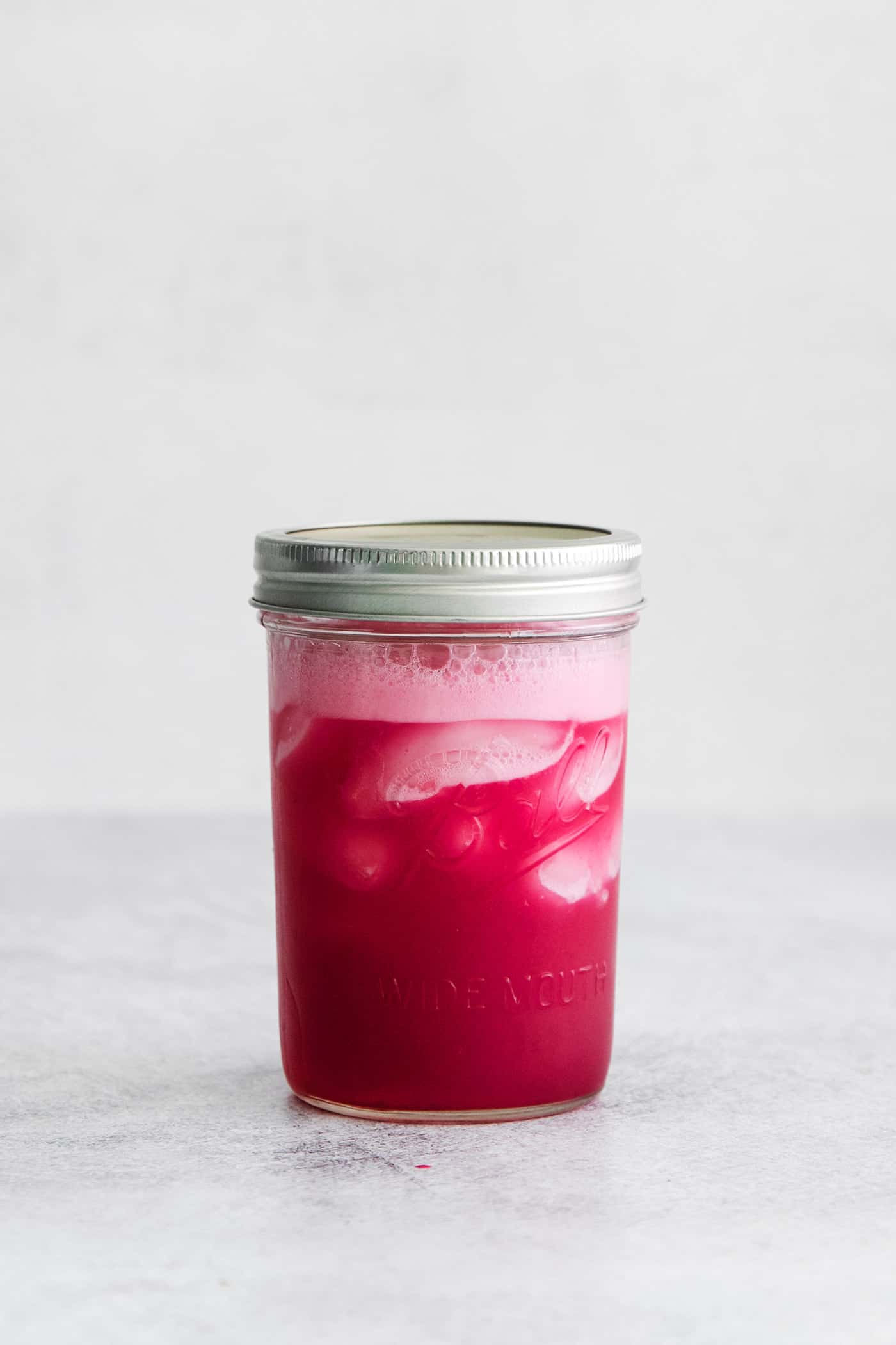 Blueberry margarita ingredients in a mason jar