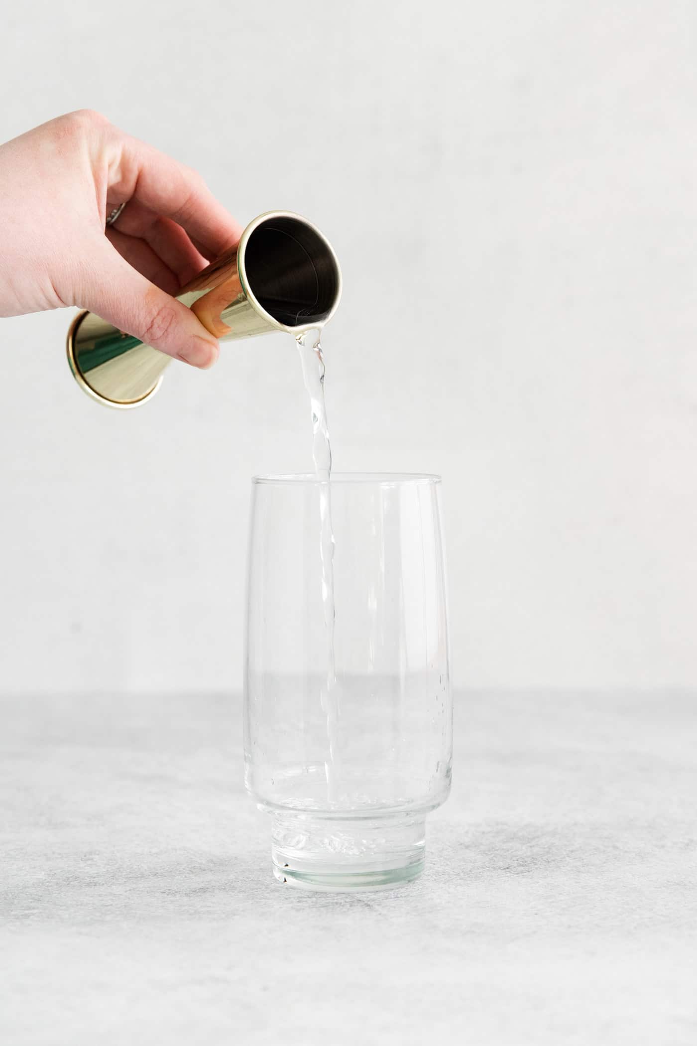 Tequila being poured into a glass