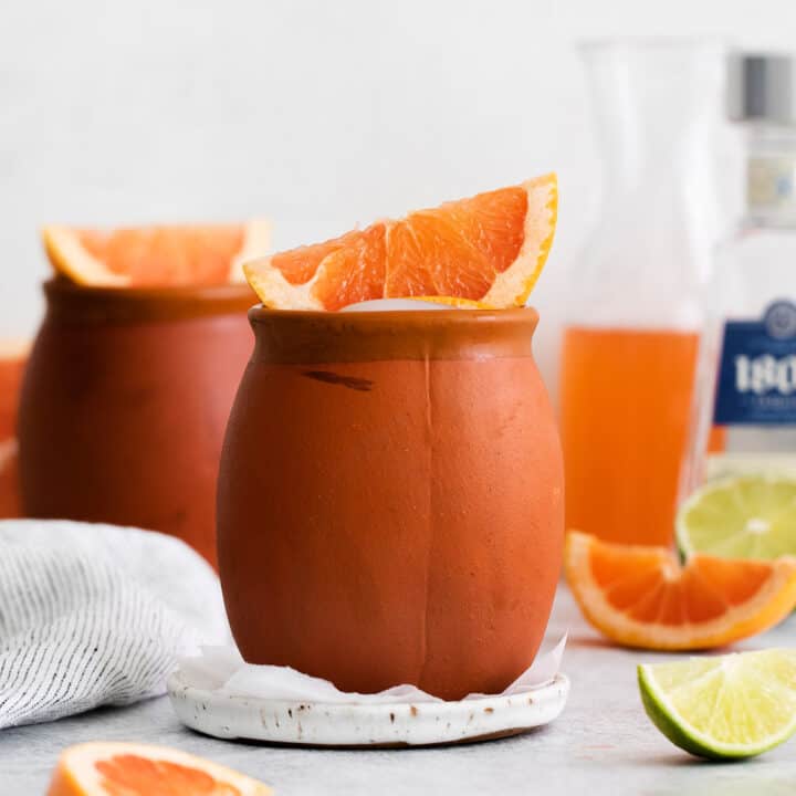A cantarito cocktail in a clay mug