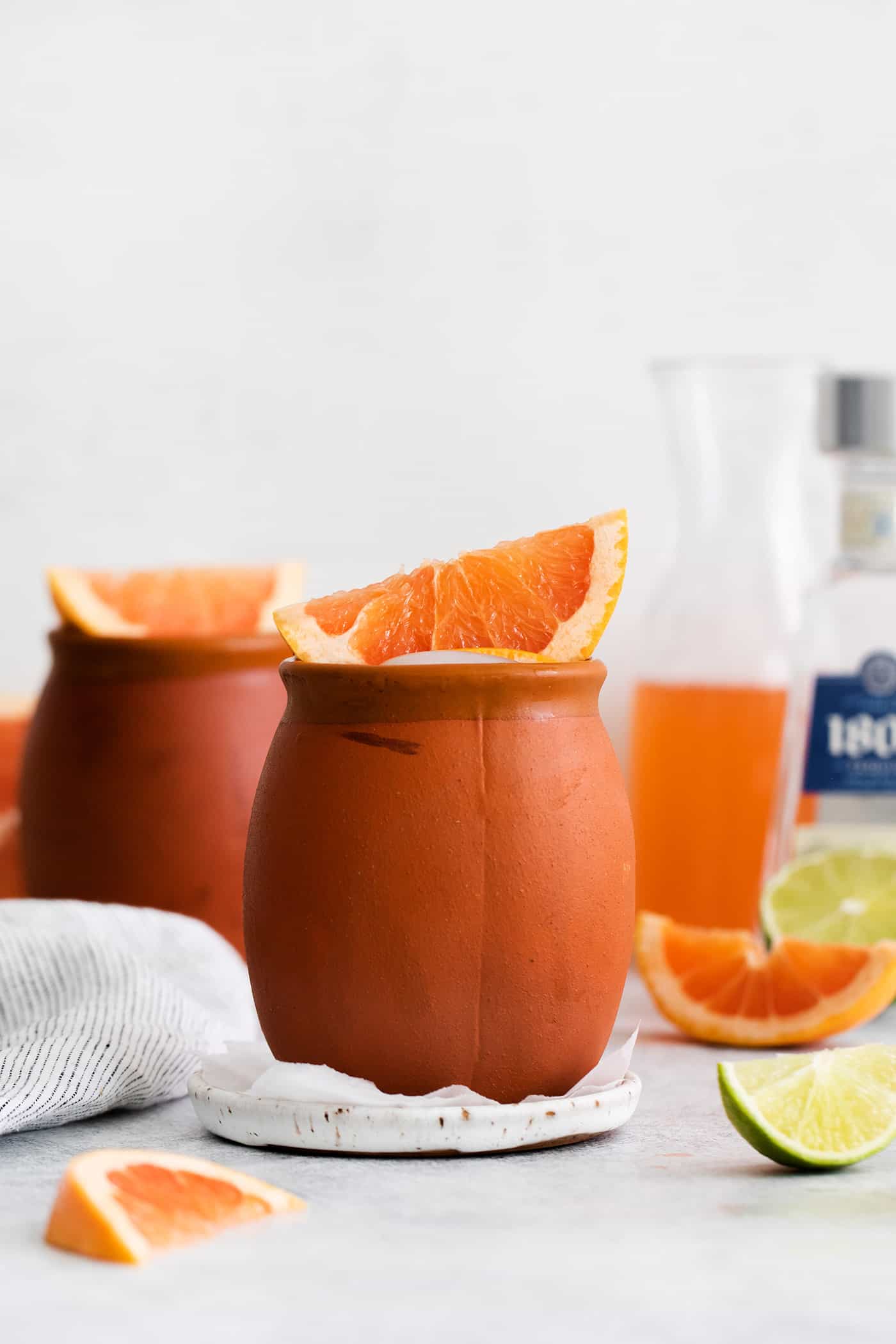 A cantarito cocktail in a clay mug