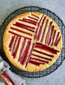 rhubarb custard cake on a cooling rack