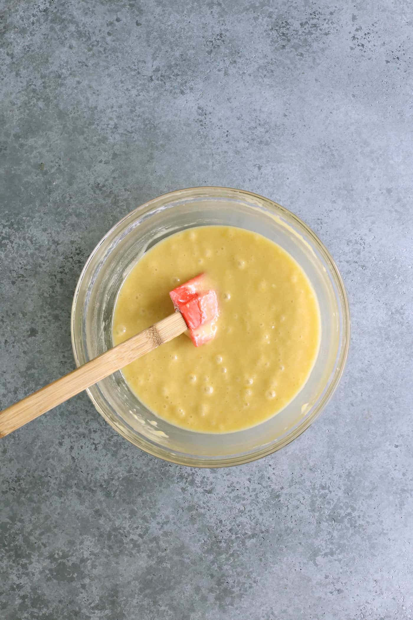 combining the butter mixture and egg mixture in a clear bowl