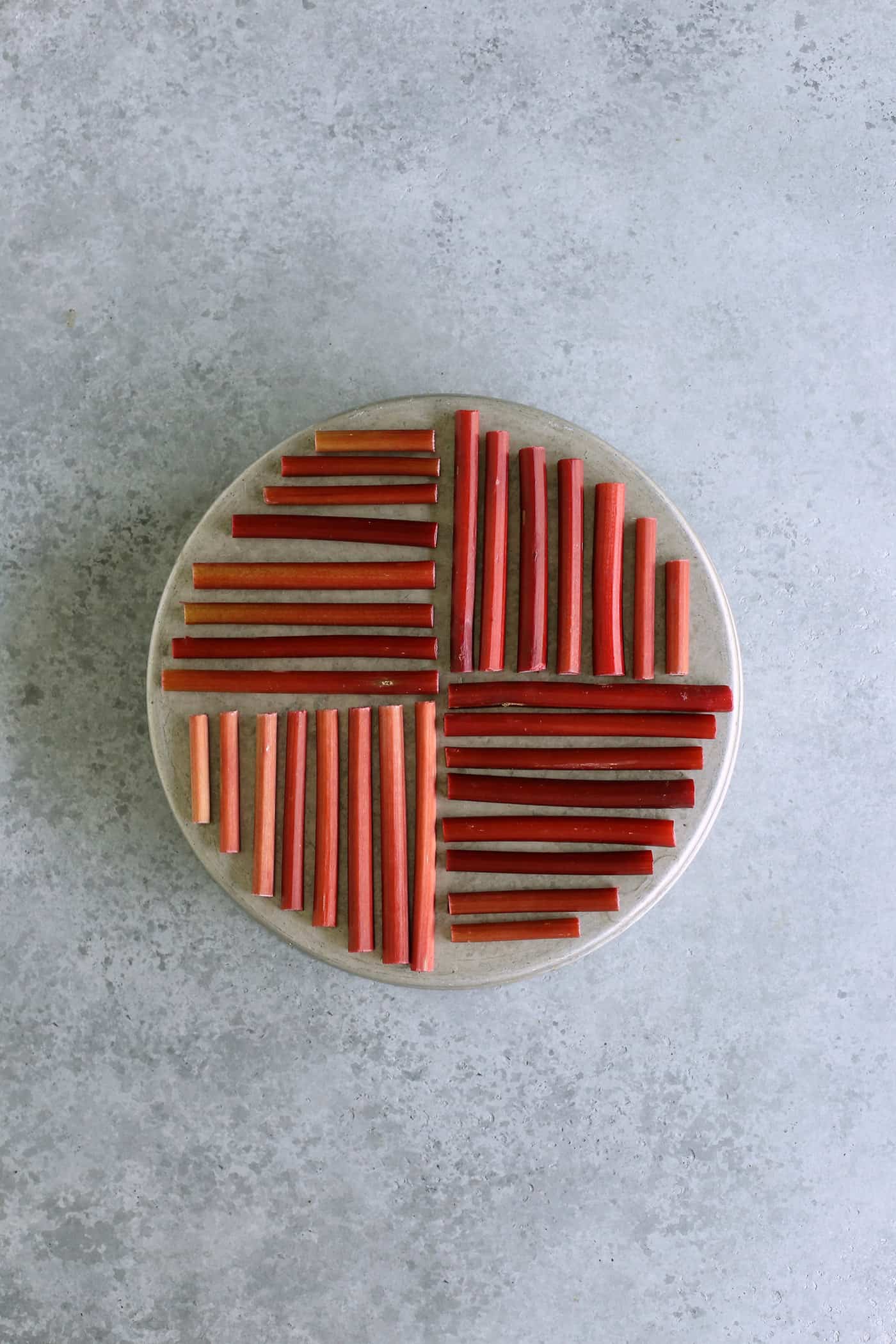 rhubarb assembled into a pattern on a round cake pan