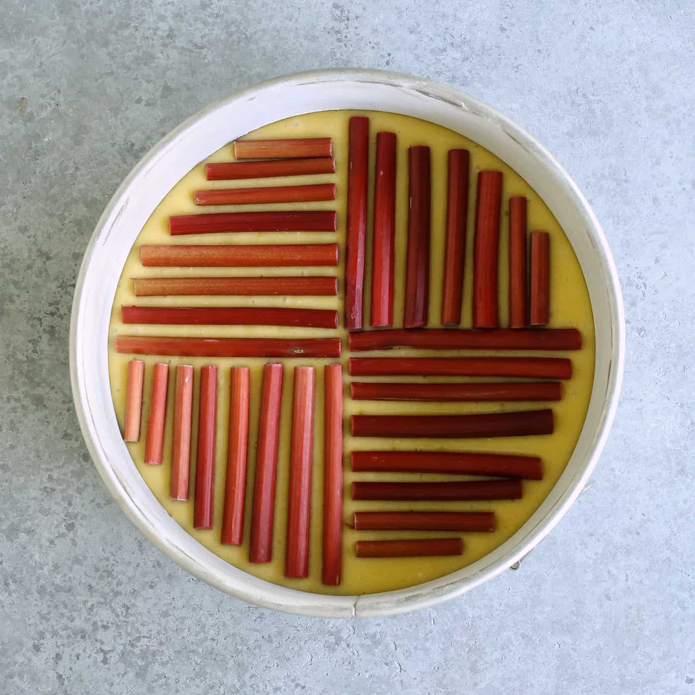 rhubarb stalks on the top of cake batter