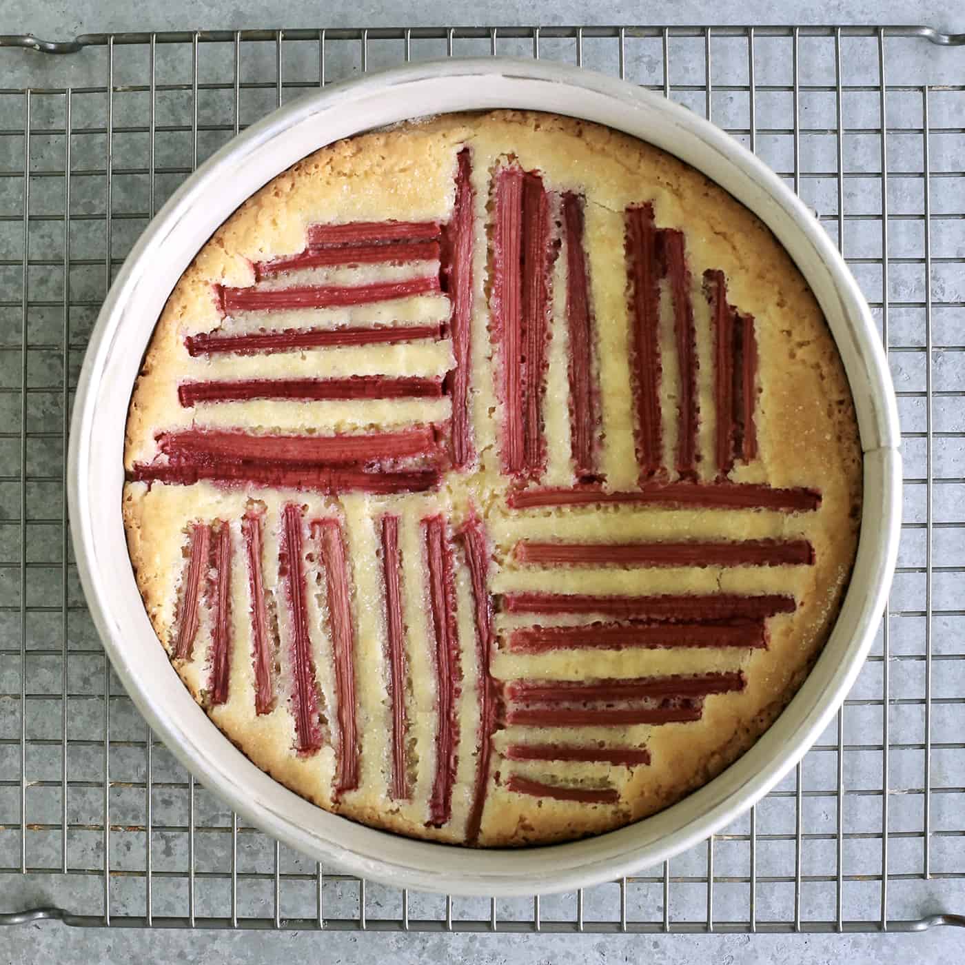 rhubarb cake cooling on a rack