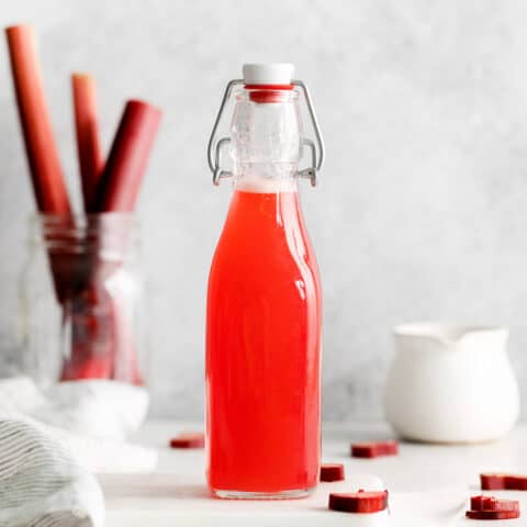 rhubarb syrup in a tall jar