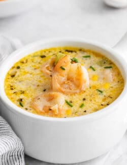 Angled view of a bowl of shrimp and corn chowder