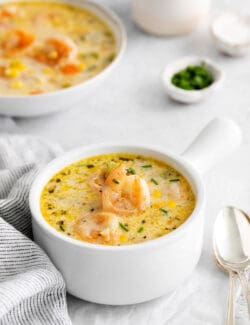 Angled view of a bowl of shrimp and corn chowder