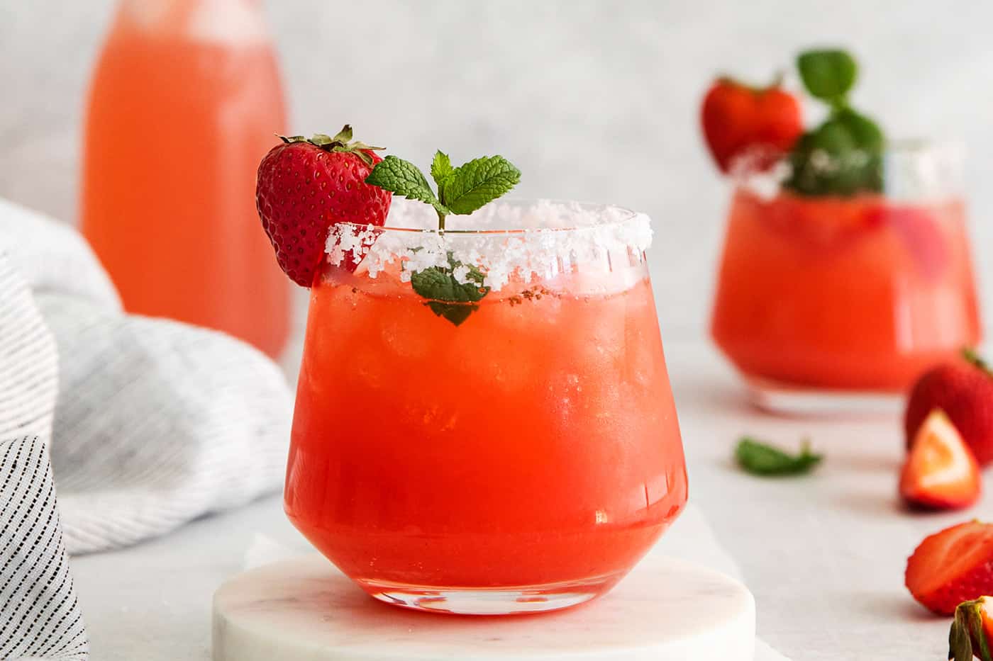 strawberry margarita in a glass, over ice