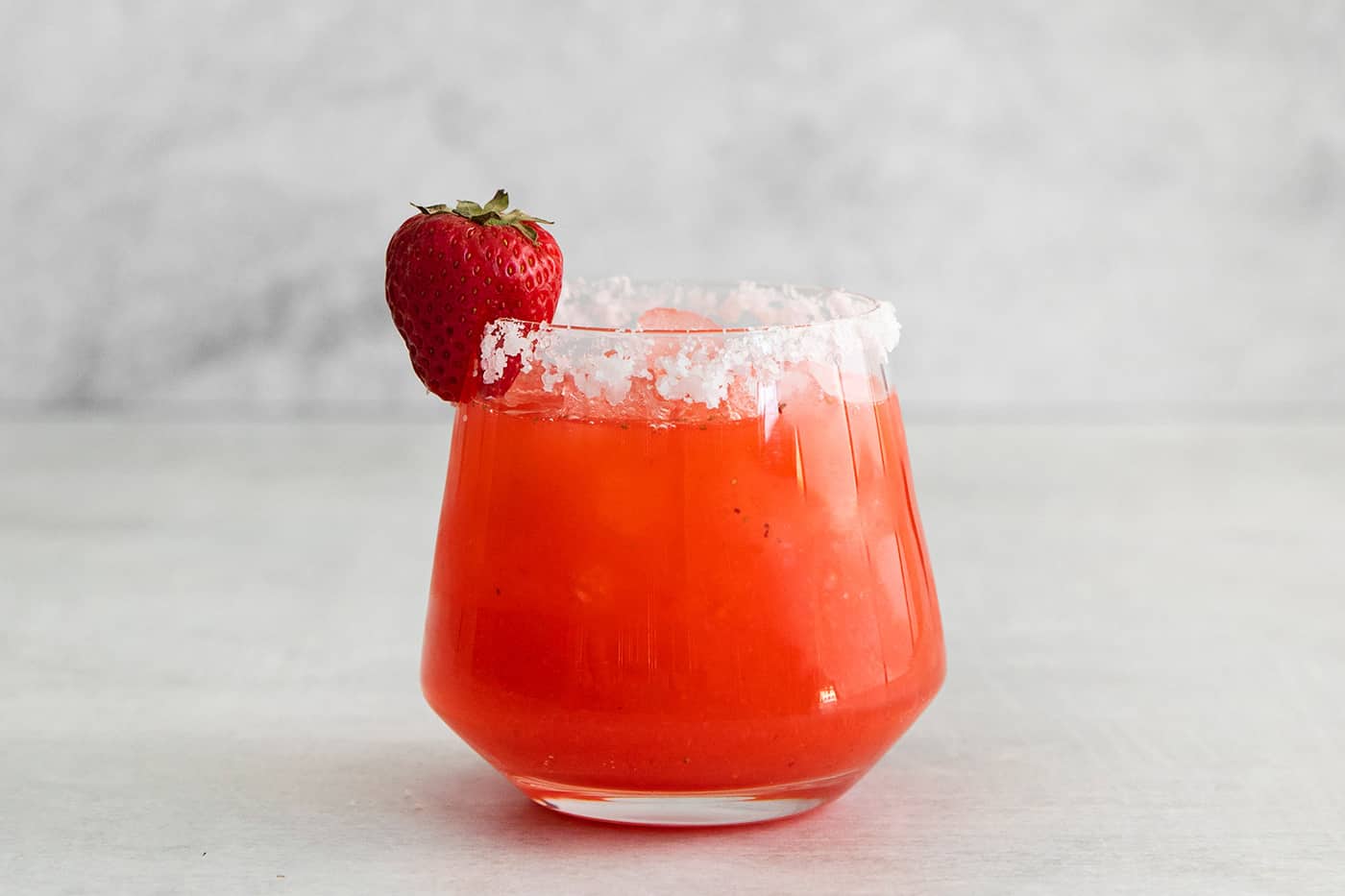 a margarita with fresh strawberry puree, in a salt-rimmed glass