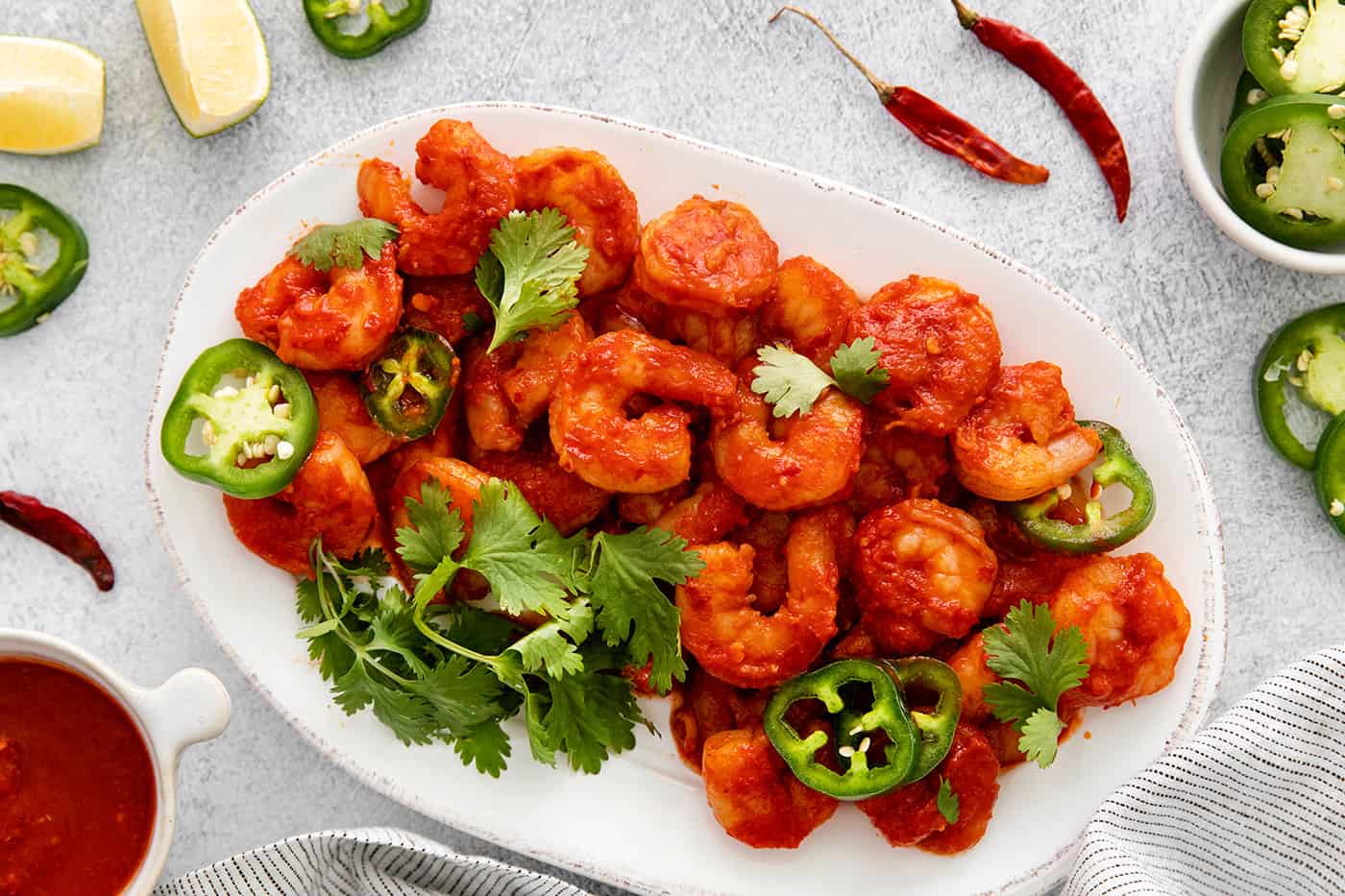 Overhead view of camarones a la diabla on a white plate