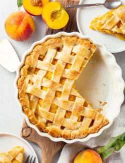 a peach pie with 2 pieces cut out