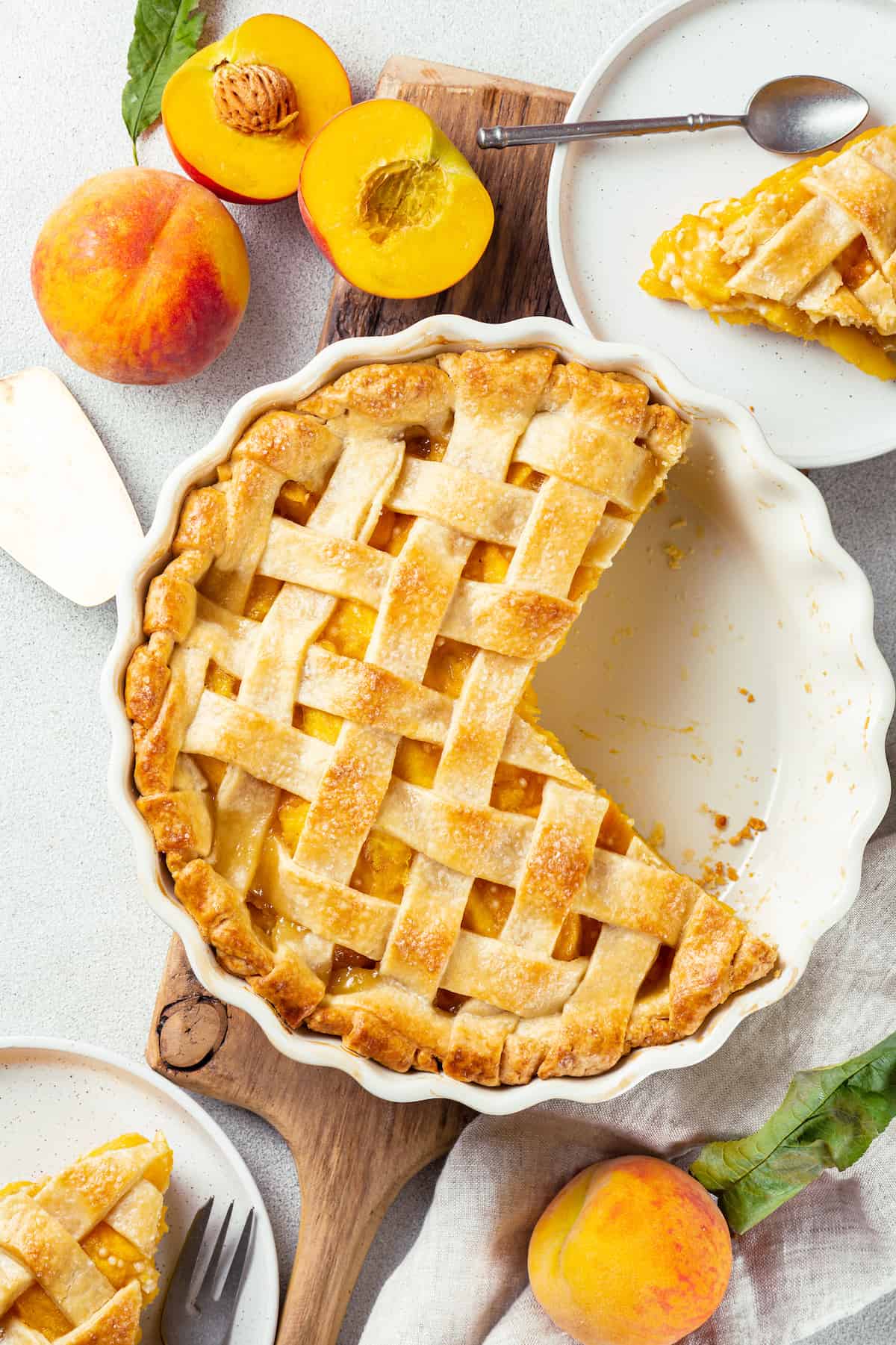 a peach pie with 2 pieces cut out