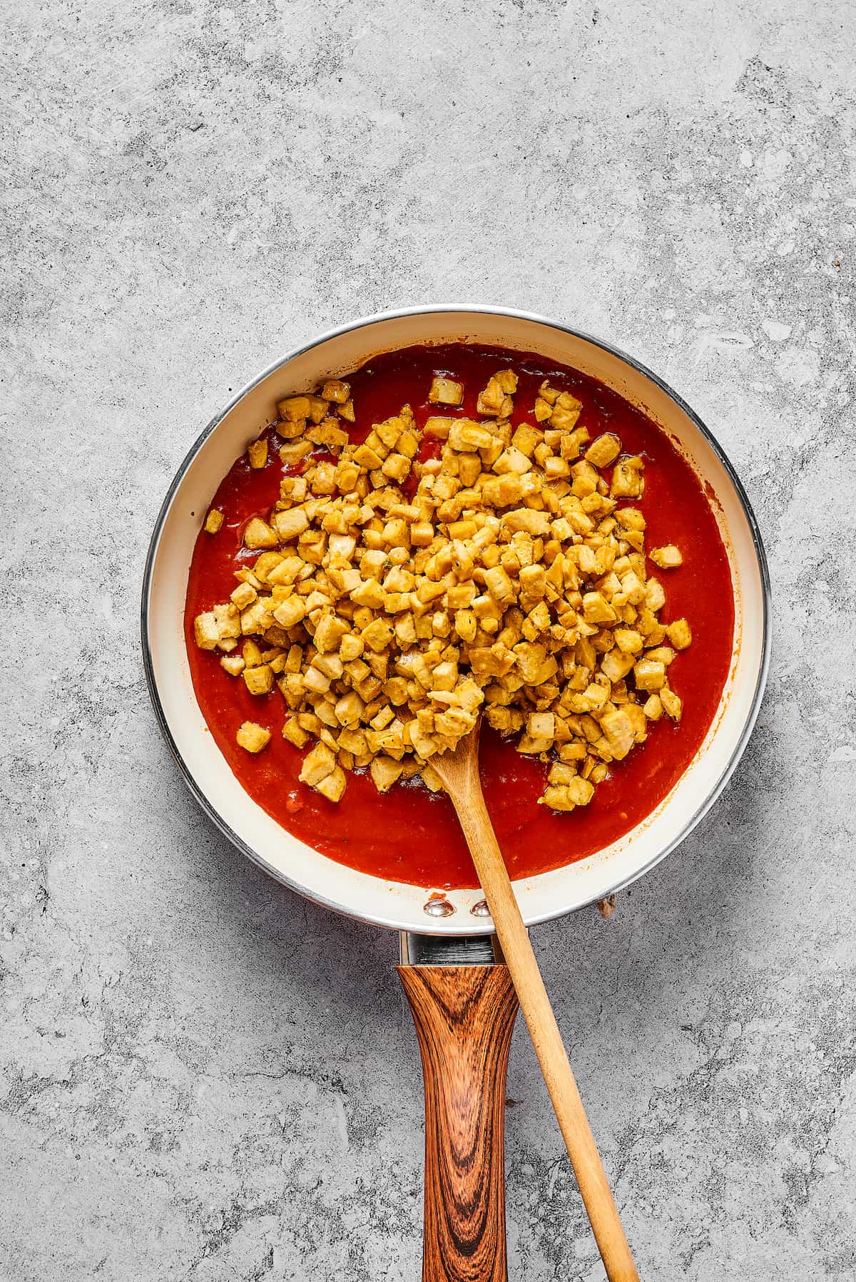 Crumbled tofu and sofritas sauce in a pan