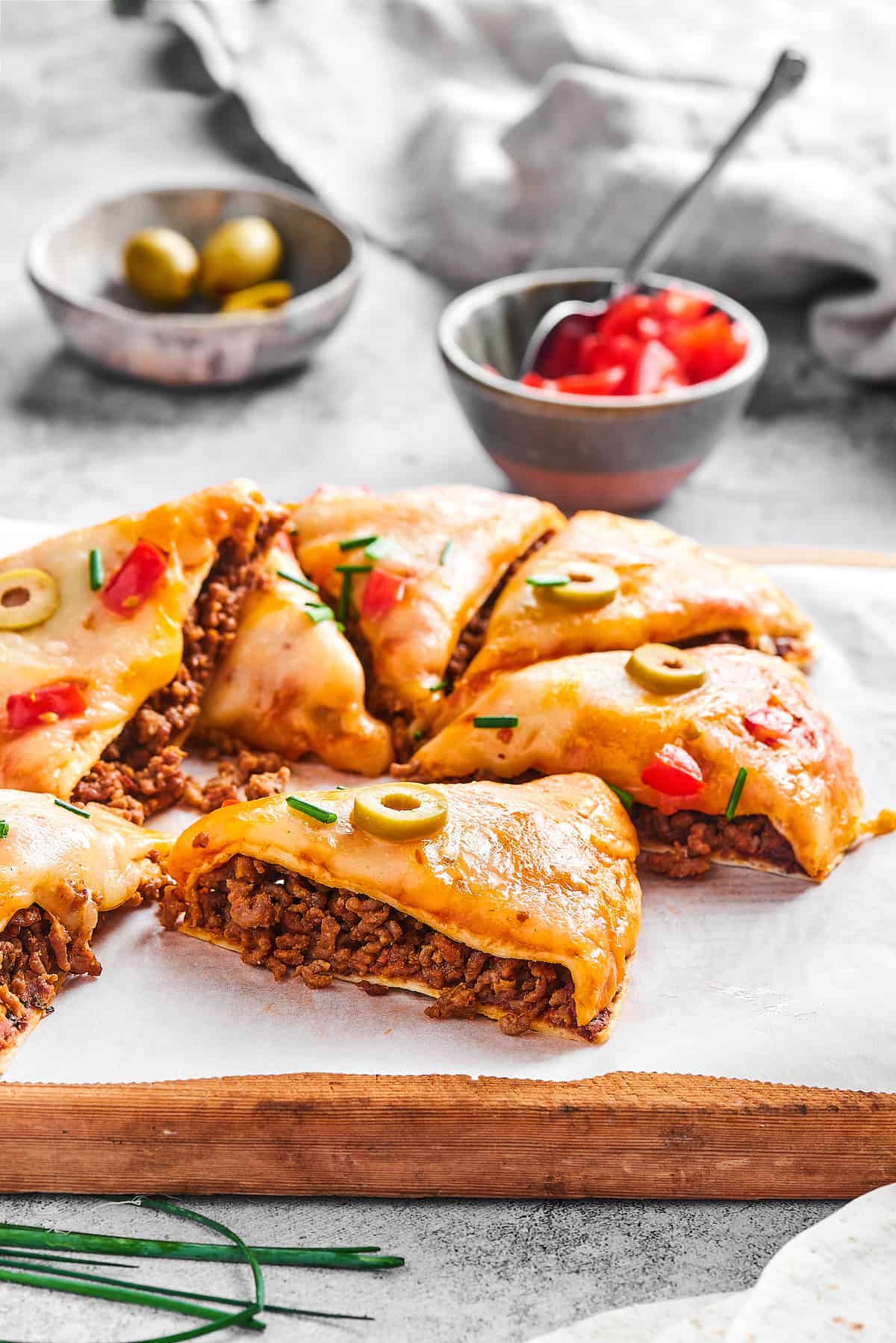 Mexican pizza cut into slices