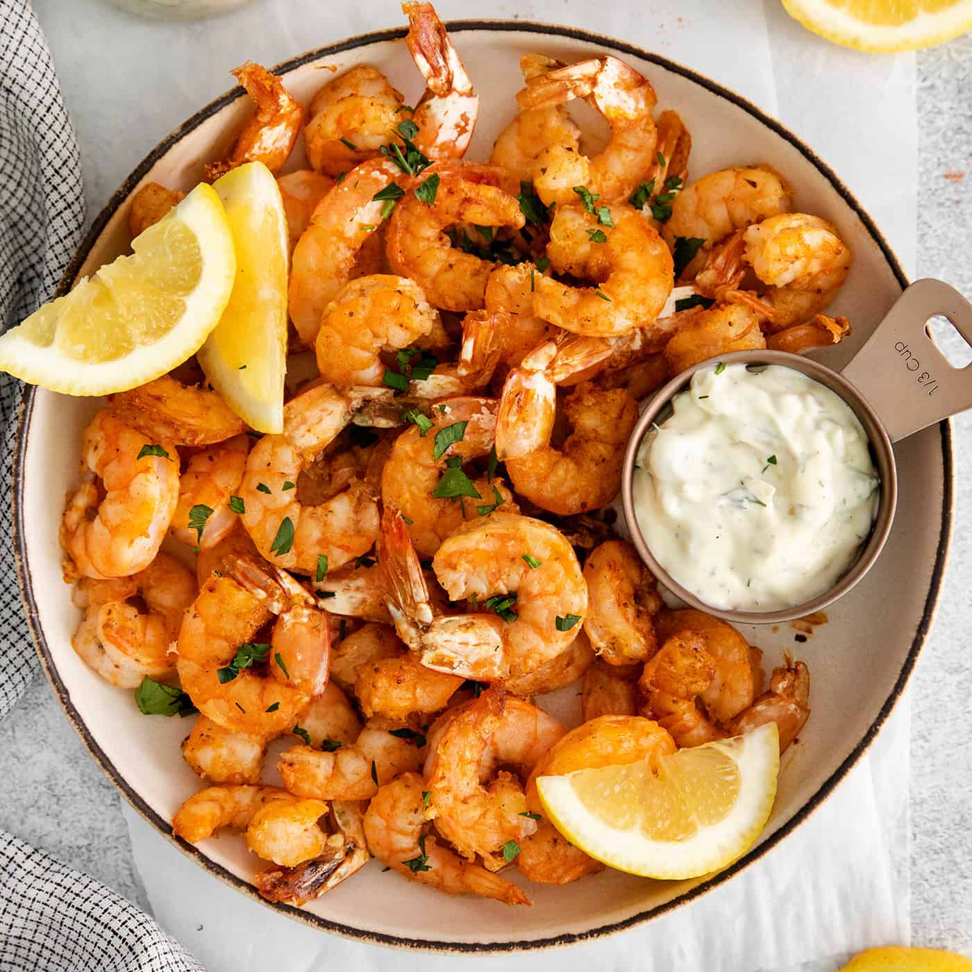 Overhead view of a bowl of air fryer shrimp.