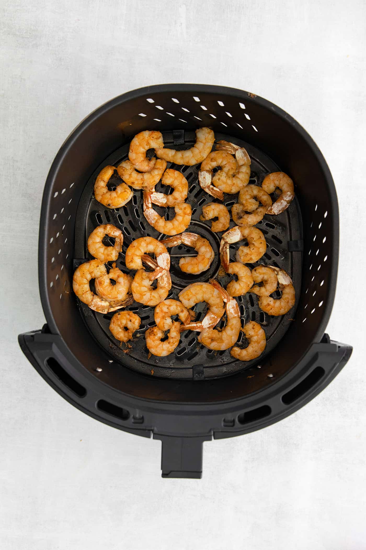 Seasoned shrimp in the air fryer.